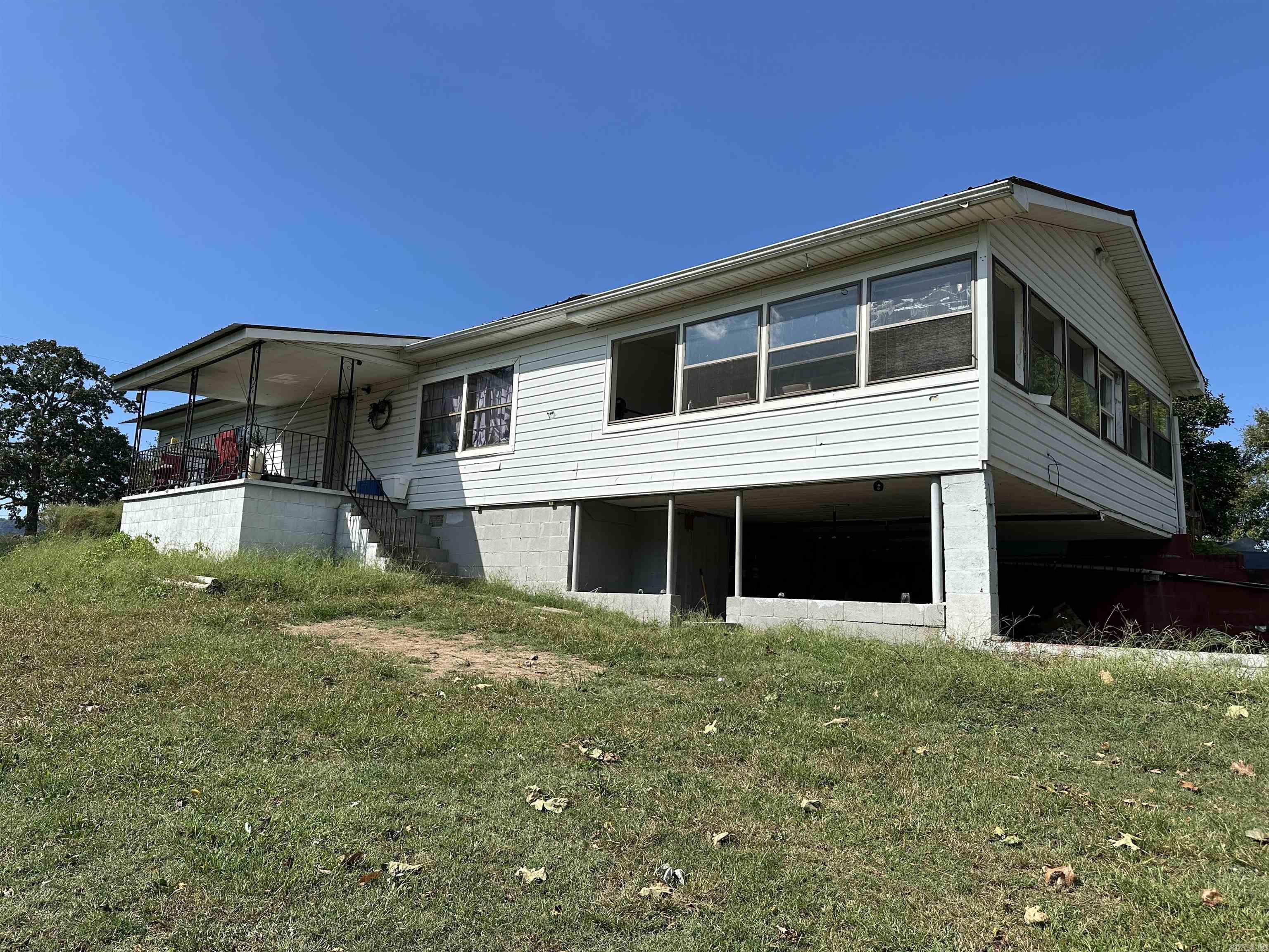 Looking for a home with land near Harrison, Arkansas? This 3-bedroom, 1-bathroom house on approximately 2 unrestricted acres m/l checks the boxes for buyers who want space, privacy, and flexibility without leaving the conveniences of town behind. The home offers a comfortable, functional floor plan with a generous living area and a kitchen that's ready for your updates and personal style. Whether you're a first-time buyer, investor, or someone downsizing from city life, the layout gives you a solid foundation to work with. The real story here is the land. Two unrestricted acres in the Harrison area means you can garden, raise animals, park your RVs, add a shop, bring in additional dwellings, or simply enjoy the open air and quiet of a rural setting. The property already has spots suitable for RV parking or could accommodate additional structures — a rare find at this price point. Located just minutes from Harrison's schools, shopping, and healthcare.
