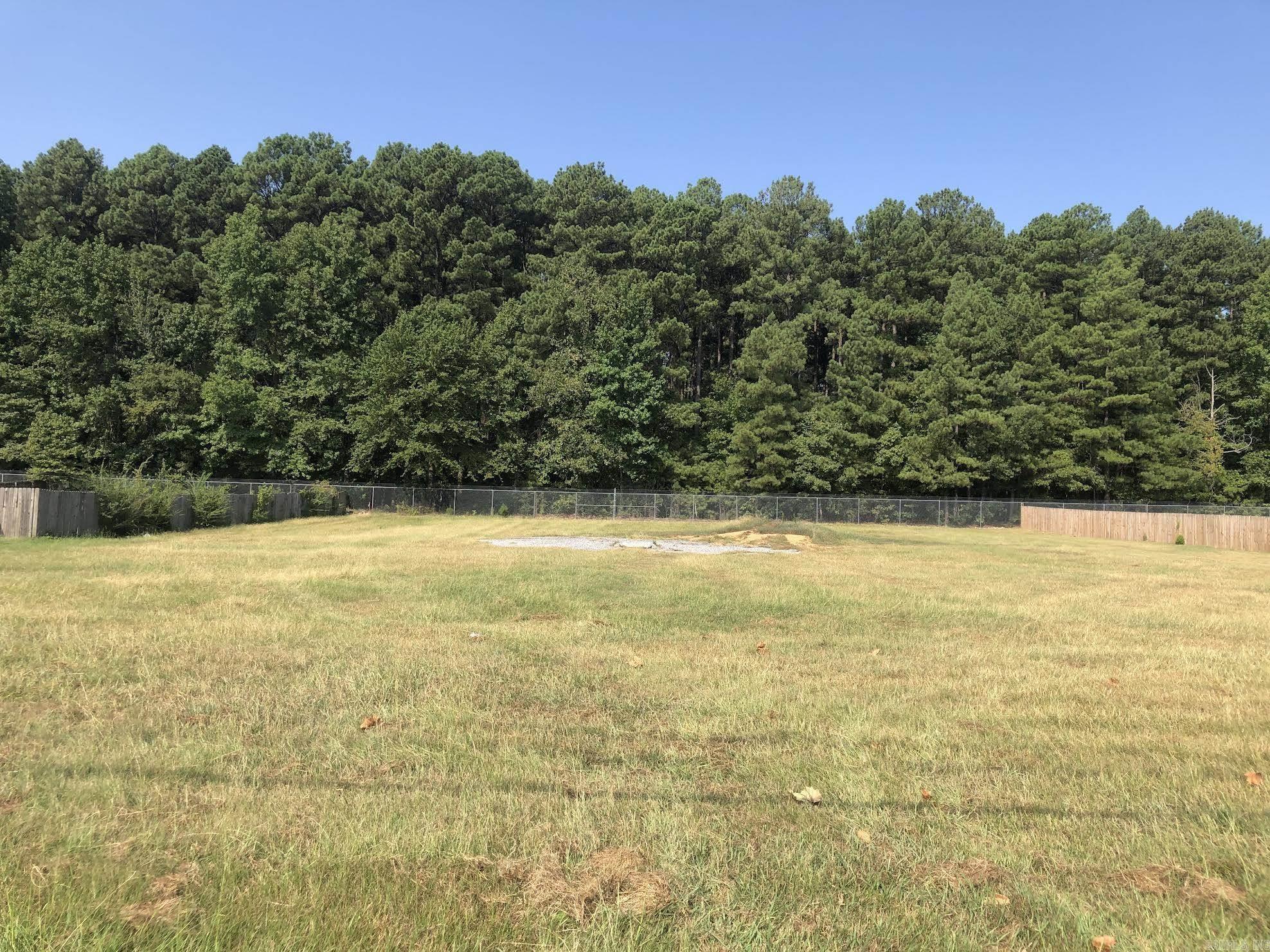 Fantastic subdivision lot! Perfect lot to build on, level and no trees! Airbase/woods behind property, no neighbors, very private! Close to everything, LRAFB, hospitals, shopping and freeway. The lot beside is for sale as well, if you want to purchase two lots for the luxury of extra space or to build two homes! Lot is 80 feet wide and 243 feet deep!