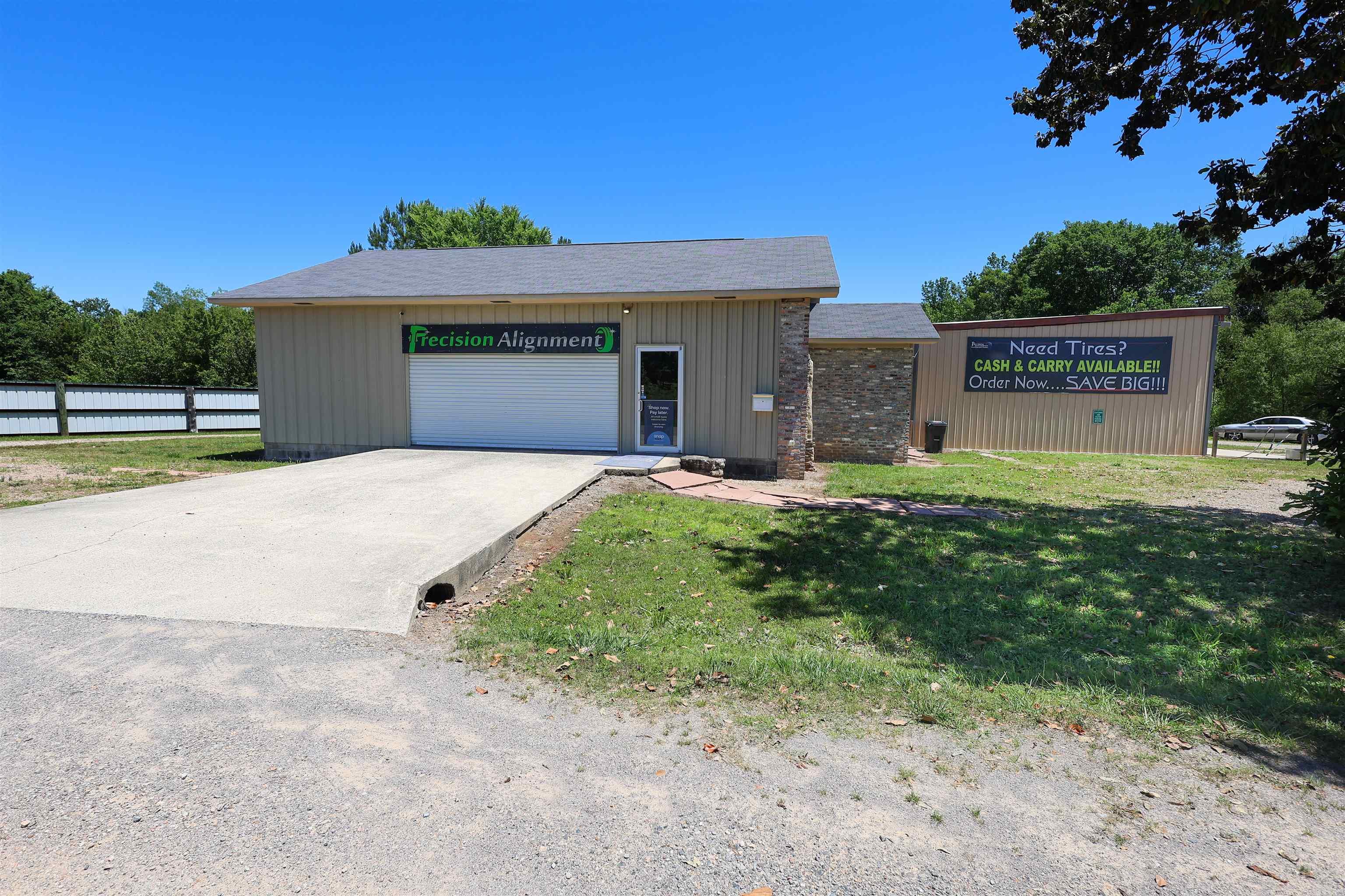 Turnkey, well-established auto service business offering a rare opportunity to own a fully equipped and operational tire and service center. The sale includes the business, buildings, and land, allowing for immediate operation with an existing base of loyal, repeat customers already utilizing the services offered.  Current services include wheel alignments, tire sales and repair, shocks and struts, and oil changes, with ample room for growth by expanding service offerings. The main shop is a 30 x 50 building featuring two bays with remote-controlled doors. A new shop A/C unit was installed in 2023.  Included equipment consists of a 4-post drive-on lift, 2019 RAC alignment system, 2023 tire rotary machine, 2021 balancing machine, and a 2021 air compressor—everything needed to continue operations without interruption.  A separate building serves as a customer reception and media area and includes an office, inventory display space, and a bathroom with a shower. This space is climate-controlled with a mini-split system for year-round comfort.  The owner is ready to retire, making this an excellent opportunity for an owner-operator or investor seeking a proven business with immediate i