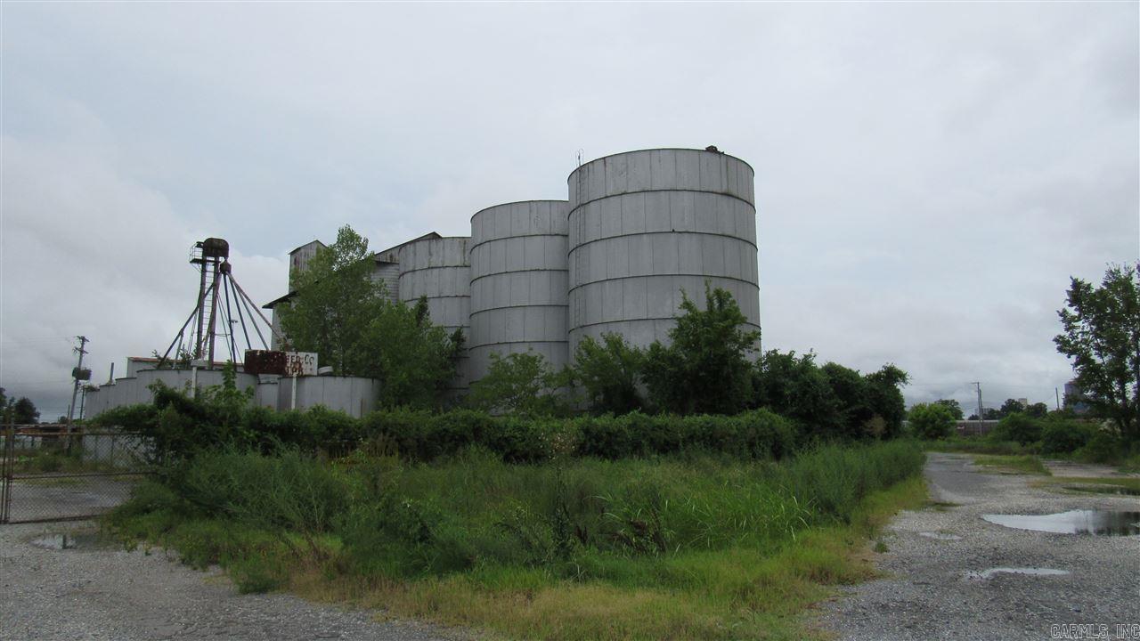 Great opportunity for large warehouse area next to rail and I-30 corridor. Huge storage tanks also included for bulk storage. Grounds are not in good condition.   Property to be sold strictly "AS IS". Buyers responsible for any utility connections for inspections. Electrical cabling  has been robbed. Possible Owner Financing.