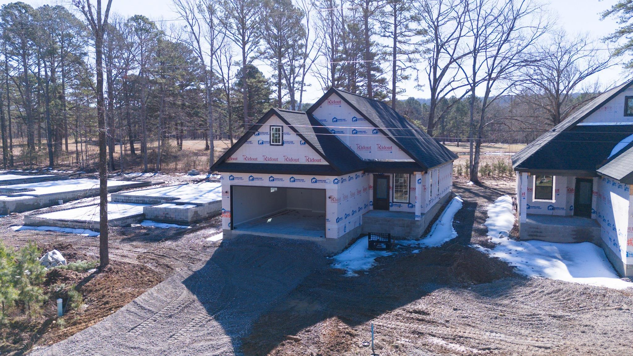 FIVE STAR rating in this 3-bedroom, 2-bath NEW CONSTRUCTION home with 1450 sq ft and quality finishes! Little Red River access and a COMMUNITY BOAT DOCK are just a few of the perks in ownership at Boulder Run! Open floor plan concept, LVP flooring, stainless appliances, quartz counters in your NEW kitchen as well as a fireplace make coming EASY and INVITING! Looking for a getaway without having to go far away? Greers Ferry Lake is just minutes away, enjoy both the RIVER and the LAKE! Call today for more details about this ADORABLE NEW HOME!
