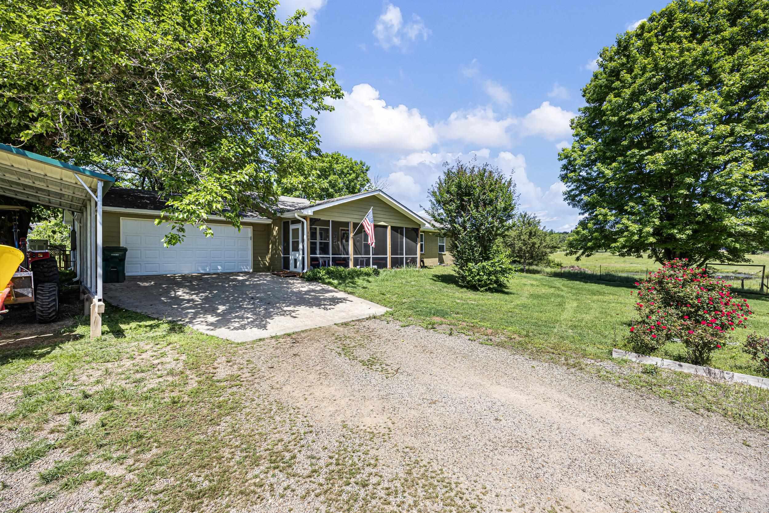 Situated on 37± acres in Pope County, this property offers the perfect blend of country living and space to grow. The 1,878 sq ft home features 2 bed, 2 baths, an attached garage, and outdoor enclosed patios. The property is well-equipped with improvements including a 36x36 shop, 12x30 goat barn, 1,100 sq ft equipment barn, and an additional 30x40 hay barn - making it ideal for farming, storage, or recreational use. The land is cross fenced and features quality mixed pasture consisting of Bermuda, fescue, and orchard grass scattered throughout, offering excellent grazing potential. Additional improvements include a chicken coop, canning room, and gardening/greenhouse building, creating a true self-sustaining homestead feel. Enjoy a stocked pond full of fish, perfect for relaxing afternoons outdoors, while the underground storm shelter adds extra peace of mind. Whether you’re looking for a homestead, mini farm, or private rural retreat, this property offers versatility, functionality, and room to make it your own.
