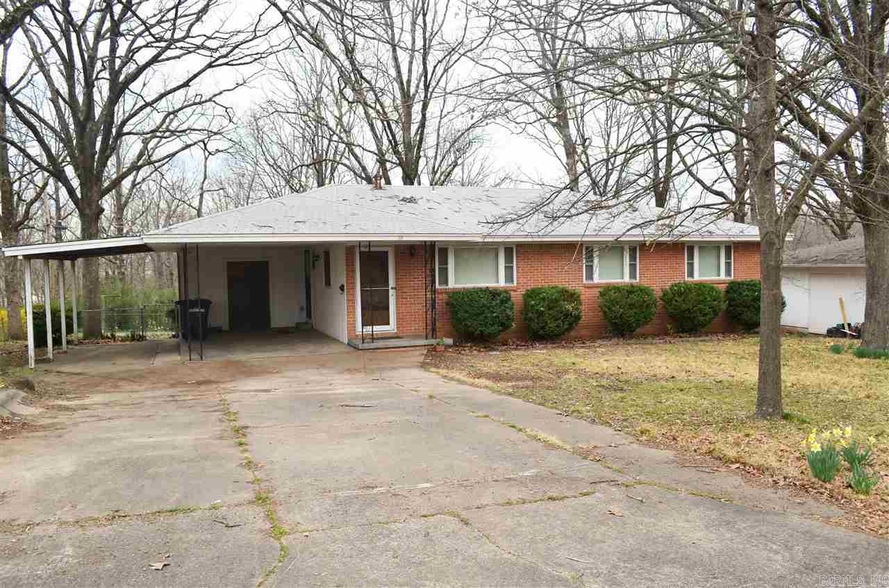 All brick 3 bedroom 2 bath home in great Sherwood neighborhood. This home features 2 living areas with hardwood floors underneath the carpet, two car carport, huge fully fenced backyard. This home is being sold "As Is".