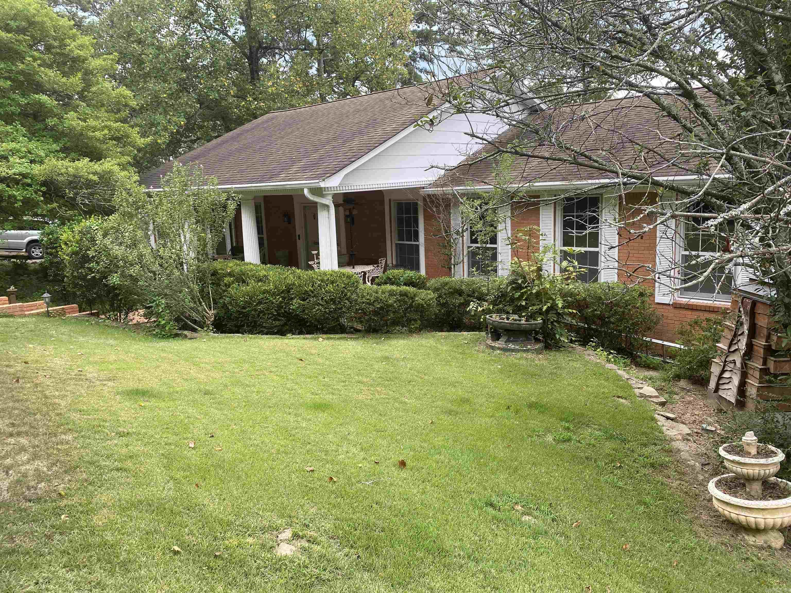 Lots of updates on this spacious 4 bedroom, 3 bath home located on a cul-de-sac.  Newly remodeled kitchen with quartz countertops and built in Sub Zero refrigerator and freezer drawers.  In 2021, the water heater was installed with hot water recycle circulation, basement encapsulation with dehumidifier, and gutter guards. Recently remodeled bathrooms with new fixtures and fresh paint throughout the home. Yard is fenced with sprinkler system and landscape lighting. The enormous brick front porch is very private framed with columns, and backyard patio is flanked with flower beds. The main level has a large master bedroom with private bath and deck, and guest bedroom. Laundry room with lots of cabinetry/pantry is off the kitchen.  Separate dining room and open living room. Downstairs has wet bar in the large TV/entertainment room with french doors to patio. Fireplace is in the family room with additional two spacious bedrooms. Unusually large closets throughout the house and safe areas for stormy weather. Don't forget that just a few blocks away is the Leawood pool and tennis courts for additional fun!