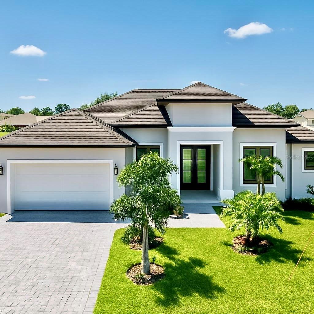 Virtually Staged. Experience the best of Florida living in this stunning, newly built luxury home. Set on a spacious half-acre lot in a quiet neighborhood. The property has beautiful landscaping, with 2,245 square feet of living space and high ceilings, the entire home feels bright, open, and grand.

Inside, the floor plan includes three comfortable bedrooms and a dedicated office filled with natural light. The main living area serves as a focal point, featuring a cozy electric fireplace with custom shelving and a large sliding glass  door that invites the outside in. The kitchen is a true highlight for anyone who loves to cook, offering a very large island, plenty of cabinet space, and a generous pantry.

The primary suite serves as a private retreat, complete with dual walk-in closets and a luxury glass shower. For ultimate convenience, a private sliding door leads directly from the bedroom to the pool area. Outside, the screened pool is perfectly private, shielded by mature trees that create a natural green fence. Built for peace of mind, the home includes impact-rated windows for added safety and quiet.
Located just minutes from famous Gulf beaches, this home offers the ideal coastal lifestyle.

Call today to schedule your private showing.
