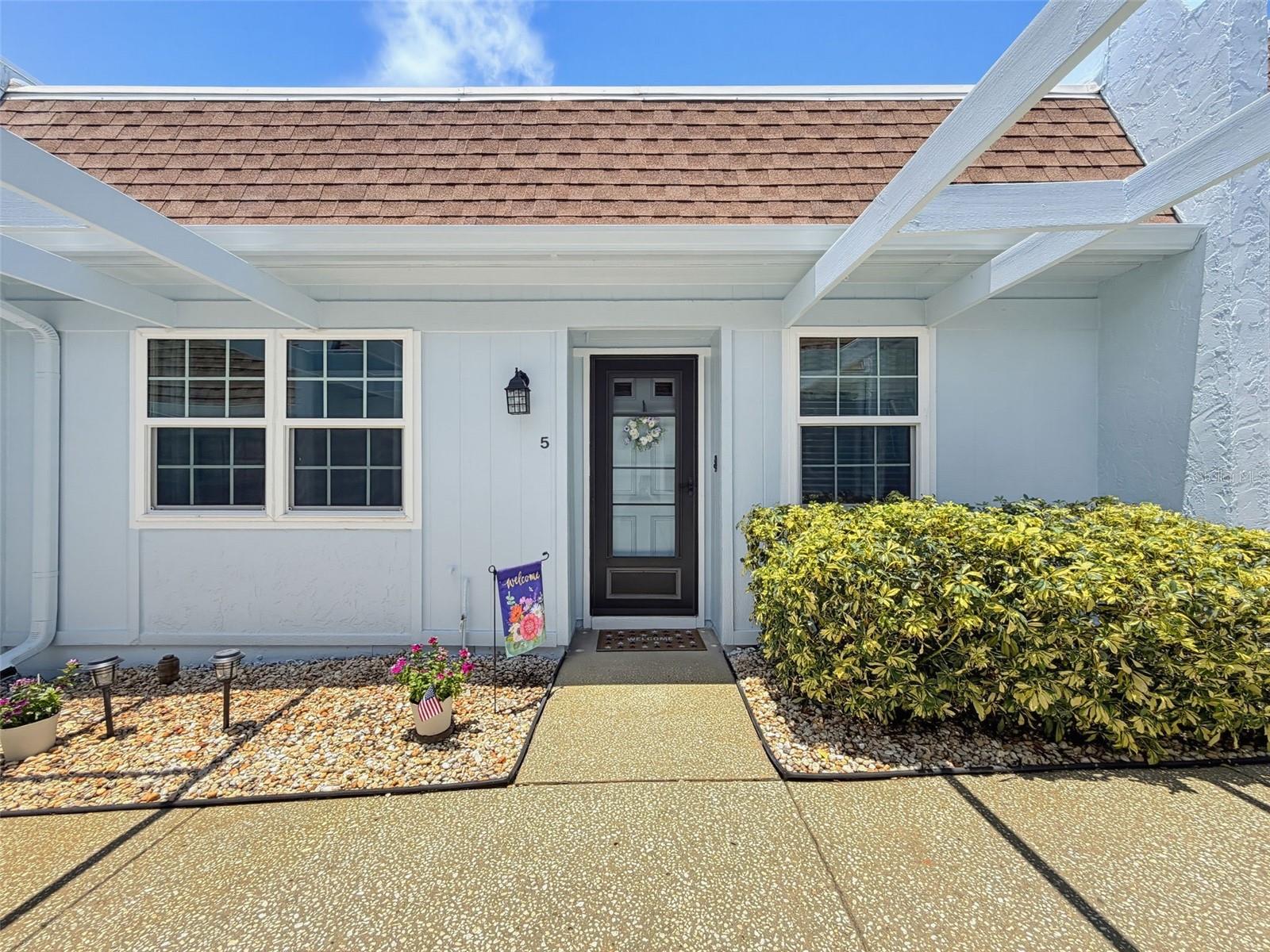 READY TO START YOUR FLORIDA LIFESTYLE!! Step into this beautifully updated 2 bedroom, 2 bathroom villa located in the desirable 55+ community of Seven Oaks in Port Richey Florida. From the moment you walk in, you'll appreciate the fresh feel created by the updated Flooring, renovated kitchen, and beautifully refreshed primary bathroom. The floor plan offers comfortable living with abundant natural light and plenty of room to relax or entertain. The updated kitchen features modern finishes and provides the perfect space to prepare meals while staying connected with your family and guests. The primary suite offers a peaceful retreat with an updated ensuite bathroom. Relax comfortably on your back screened Lanai, complete with new vinyl windows, so the space can be enjoyed year round. The community pool is just a short walk directly across the parking lot from the villa, and the main community pool just a short drive. You'll have access to BOTH! The villa has one covered parking space and a storage shed near the parking space. The buildings were also just freshly painted.

Enjoy low maintenance living in a welcoming community where you can spend more time enjoying Florida's sunshine and less time worrying about upkeep. Association fees also include water, sewer, cable & internet package! AMAZING VALUE! This villa is located near shopping, dining, medical facilities, parks, and the Gulf Coast, this villa offers the perfect combination of comfort, convenience, and value. Don't miss your opportunity to own this move-in ready gem. Schedule your private showing today!