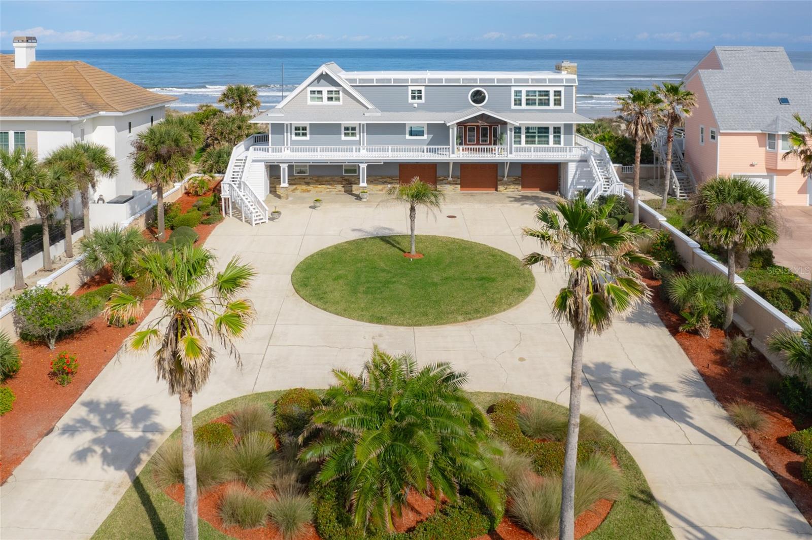 Discover your oceanfront dream home perched atop the Crescent Beach dunes. Spanning 4,215 square feet, this residence invites sophisticated coastal living. Nestled on a .76-acre lot, it boasts 100 feet of exclusive ocean frontage along the Atlantic Ocean. Enjoy unobstructed, panoramic views of the ocean to the east and breathtaking sunset vistas over the Intracoastal to the west. Recent comprehensive renovations showcase quality craftsmanship and high-end finishes throughout. This design masterpiece offers five bedrooms and four bathrooms, ensuring ample space for relaxation and privacy. It's perfect for entertaining, whether inside or on the expansive deck that spans the home's length. Here, you can accommodate friends and family, enjoying the ocean breeze and dining al fresco. The home's west side offers serene views of the Intracoastal, providing a peaceful contrast to the vibrant oceanfront. Upon entering through the double gates, you're welcomed by manicured grounds and a double circular driveway. Ascending the stairs, the sound of the ocean calls, with its vistas on the horizon. Passing through the double glass front doors into the foyer, the kitchen lies to one side and the family room to the other. The gourmet kitchen, a chef’s dream, features quartz countertops, stainless steel appliances, and a farmer sink with direct Intracoastal views. The formal dining room, situated oceanside, connects to a 29 x 16 family room adorned with built-in cabinets, shelving, and electric shades. The home's unique A-frame section, housing a cozy living room with a wet bar, two bedrooms, and a bathroom on the lower level, and a secluded guest suite above, adds character. The master suite occupies the entire upper level, offering privacy, luxury, and sweeping ocean views. It features wall-to-wall windows, built-in cabinets, and an en-suite spa-like bathroom with a soaking tub, an oversized shower, dual vanities, and personal laundry facilities. The lower level introduces an ingeniously designed ensuite with a Murphy bed and a bathroom that smartly includes a stackable washer/dryer. The oversized three-car garage, with epoxy floors, provides ample storage for beach gear. This residence is not merely a home but a statement of luxurious coastal living, blending spacious, meticulously designed living areas with the natural beauty of its oceanfront setting. It promises an exclusive lifestyle for those who value privacy, luxury, and the timeless allure of the ocean. A full list of renovations and potential short term rental proforma available upon request. Welcome to paradise!