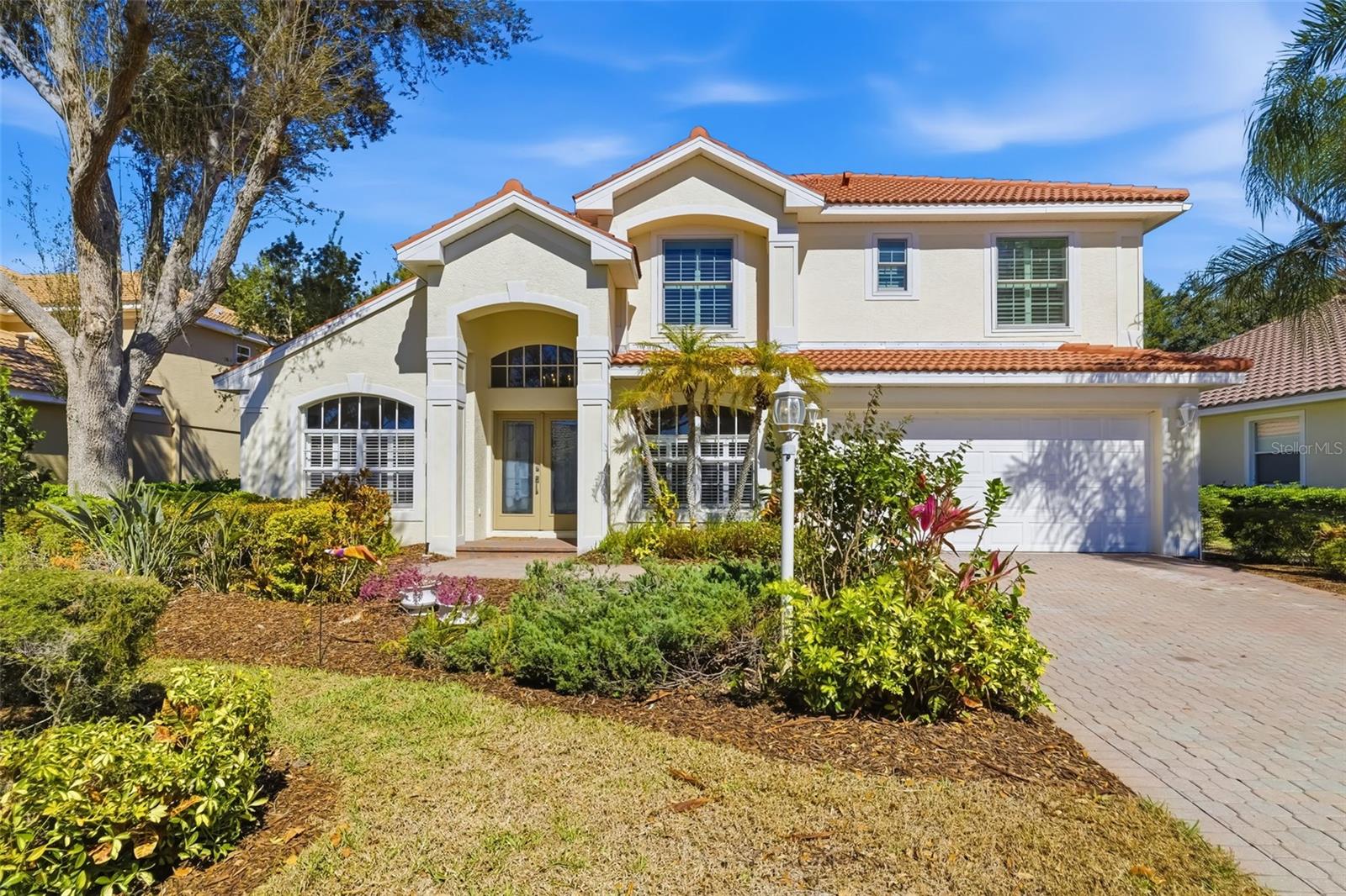 Set within the prestigious gates of Lakewood Ranch Country Club, this exceptional Neal-built residence offers 2,865 square feet of refined Florida living. Thoughtfully designed with four bedrooms 2.5 bathrooms inside, plus a private office or study.  The home makes an immediate impression with soaring 18-foot ceilings in both the living and family rooms, filling the space with natural light and architectural drama. Rich wood flooring and tile span the entire first level, enhancing both elegance and functionality.

Seamless indoor-outdoor living defines the home’s appeal. The expansive 47x37 screened lanai showcases a heated pool and an impressive 32x10 covered entertaining area, ideal for hosting gatherings or enjoying tranquil evenings. An additional private pool bath adds convenience and sophistication to the outdoor retreat.

Recent upgrades and premium features include a new barrel tile roof, freshly painted interior, whole-house generator, newer air conditioning system, newer hurricane-impact windows on the second level, gas stove, gas water heater, and a spacious laundry room with utility sink. The two-car garage provides ample storage, while lawn and yard maintenance are included for effortless living.

Residents enjoy access to a beautifully appointed community gathering area featuring a covered pavilion, pool, and spa. This is a rare opportunity to own a meticulously maintained home in one of Lakewood Ranch’s most sought-after country club communities.