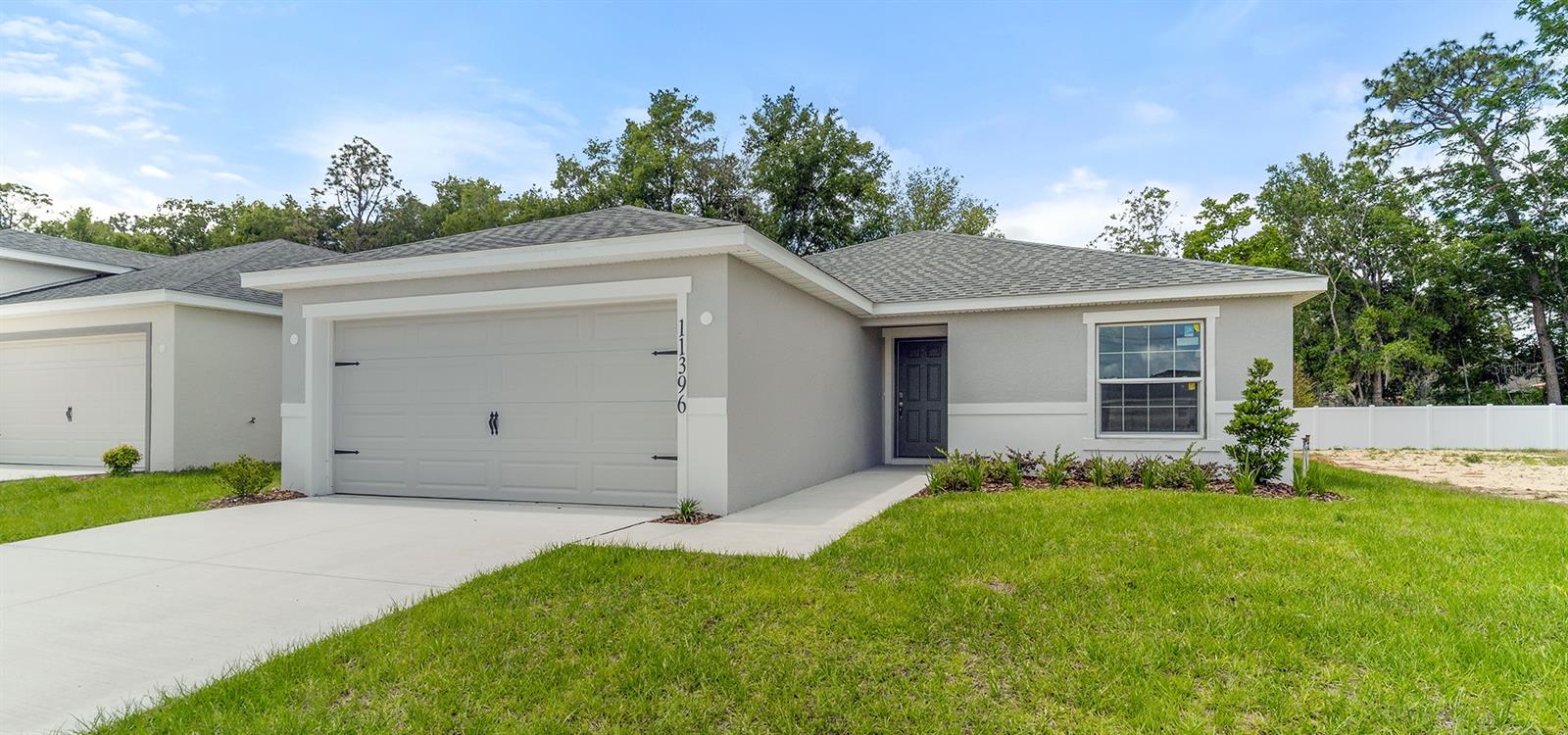 New construction home with 1,545 square feet on one-story including 3 bedrooms, 2 baths, and an open living area. Enjoy an open kitchen with Quartz countertops, Samsung stainless steel appliances, a walk-in pantry, and a spacious island, fully open to the dining café and gathering room. The living area, laundry room, and baths include luxury wood vinyl plank flooring, with stain-resistant carpet in the bedrooms. Your owner's suite is complete with a walk-in wardrobe and a private en-suite bath with dual vanities, a tiled shower, and a closeted toilet. Plus, enjoy a covered lanai, 2-car garage, custom-fit window blinds, architectural shingles, energy-efficient insulation and windows, and a full builder warranty. "Please note, virtual tour/photos showcases the home layout; colors and design options in actual home for sale may differ. Furnishings and décor do not convey.”
