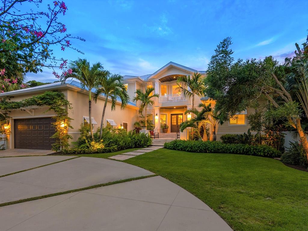 Stunning Siesta Key Bayfront home!  Conveniently located on the north end of Siesta Key and nestled among lush tropical landscaping, this fabulous 5,436 sf home has much to offer the discerning buyer. Boasting 5 ensuite bedrooms, 2 offices, a huge bonus room, expansive outdoor terraces, a resort-style pool and an incredible boat docking system, you’ll find plenty to love and enjoy here in this bright and airy coastal style home.  Completely renovated in 2015, the level of detail, the quality of the finishing and the thoughtful design of the interior living space can be appreciated in every room of the house - many of which enjoy beautiful open water views with a southerly exposure. The carefully designed floor plan that can accommodate plenty of guests and extended family while allowing space for two to work from home in separate dedicated offices.  Beautifully designed for those who love to cook and entertain guests, the centerpiece of the gourmet kitchen is a stunning large granite topped island.  The great room has 3 sets of sliders opening onto a large covered terrace which has a full outdoor kitchen and superb views out over the water. The ground floor comprises the owners suite, two guest suites, the main living area, and an office; the second floor has two more guest suites, an additional office, a fitness/hobby/storage room and a multi-functional bonus room that is currently used as a den/games room.  This opens out onto a large upper covered terrace with a gas fireplace and a spacious seating area from which to enjoy the spectacular views across the water. The outdoor living area and backyard is a real show stopper for this property. The multi-level terraces, the large freeform pool and spa framed by coconut palms, and the expansive views from the pristine dock make you feel that you are in your very own private tropical resort. Boaters will delight in the no-profile lifts that can accommodate kayaks, a motorboat, paddle boards, or jet skis, and there is an additional deep water dock for larger boats. 
Detailed feature list attached to MLS but additional features include outdoor shower and pool bath, fitness/hobby/storage room on second floor, large air conditioned storage space above garage, all bedrooms are ensuite, docking for large sailboat or motorboat, two no profile lift platforms for up to 10,000lb boat and 5,000lb of water toys (jet skis, paddle boards, kayaks, etc), electric, remote controlled front gates, fully fenced. Room sizes are approximate and should be verified by buyer. Tax records show effective age of 2012. Originally built in 1997. Room Feature: Linen Closet In Bath (Primary Bathroom).