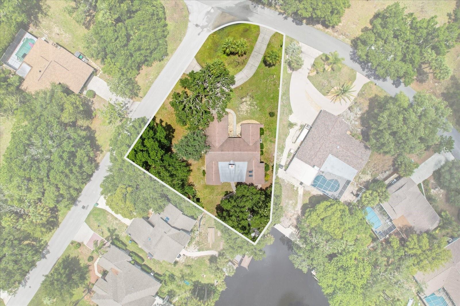 Coastal comfort and waterfront adventure come together in this beautifully updated home in Riverhaven Village. Perfectly situated on a large corner lot along a deep-water canal, this beautifully updated 3-bedroom, 3-bath home offers direct access to the Homosassa River and the Gulf, making it a dream for boaters & those who love fishing, kayakers, scallopers, or anyone who loves life on the water. From the moment you arrive, the circular driveway and inviting curb appeal set the tone for this exceptional property. Inside, you'll find a bright and welcoming floor plan featuring cathedral ceilings, tile flooring throughout, updated lighting, attractive ceiling fans, and fresh interior paint. A stunning wood-burning fireplace accented with travertine style tile creates a warm focal point in the living area, while double sliders open to the large screened porch and waterfront views.
The heart of the home is the gorgeous updated kitchen, thoughtfully designed for entertaining. Featuring a massive island with bar seating, gorgeous quartz countertops, double ovens, two sinks, a pot filler, pantry, subway tile backsplash, under-cabinet lighting, and abundant cabinetry, it's a space where family and friends naturally gather.
Offering two ensuite bedrooms, this home is designed for hosting guests, multi-generational living, or creating the perfect vacation getaway. The additional guest room even includes a convenient Murphy bed for added flexibility.
Outdoor living is just as impressive. Enjoy morning coffee or evening cocktails on the screened porch overlooking the shaded backyard and canal. Gather around the fire pit and paver patio, launch a kayak from your backyard, or head out from your own boat dock for a day on the water. An outdoor storage room provides the perfect place to keep fishing gear and boating essentials organized. Adding even more versatility is the enclosed bonus porch with a full bathroom, accessed through the screened porch or exterior slider. Whether you envision a game room, a spa, man cave, hobby space, guest retreat, or something uniquely your own, the possibilities are endless.
Additional features include updated bathrooms, durable PVC trim and PVC walls 4ft up, mini-split systems - an excellent flow designed for both everyday living and entertaining. A convenient upgrade, the garage is equipped with a 6-circuit transfer switch, making generator hookup quick and easy. Whether you're looking for a full-time residence, seasonal escape, or vacation rental opportunity, this waterfront gem delivers the Florida lifestyle you've been dreaming of. Optional social membership is available and provides access to the community pool, clubhouse, tennis courts, pickleball courts, dog park, and a variety of social activities and events. Located just minutes from waterfront restaurants, Riverhaven Marina, Homosassa Springs, Crystal River, world-class fishing, scalloping, and endless outdoor adventures, this is coastal living at its finest. As a bonus, this home comes partially furnished! Check the details for items that are included.