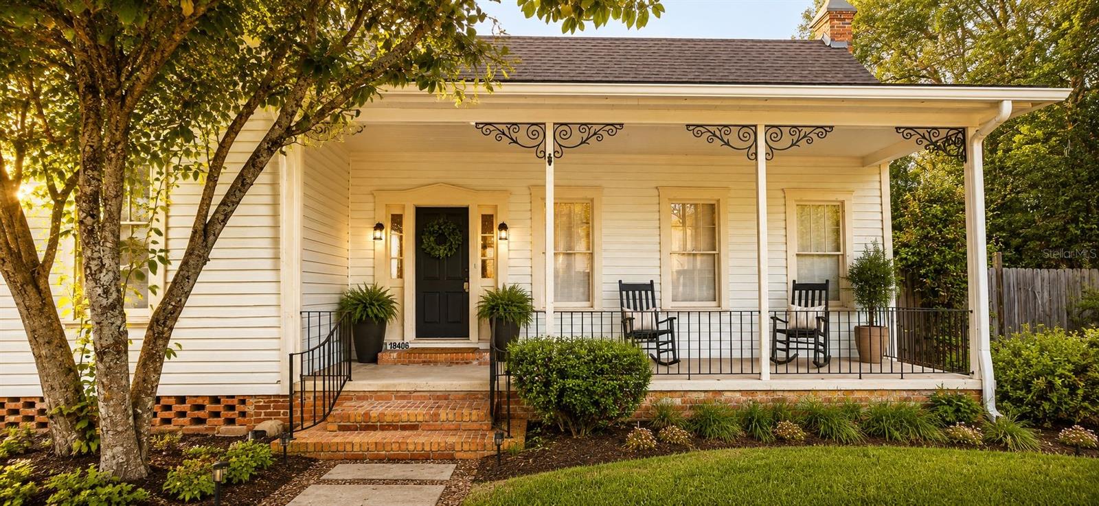 One or more photo(s) has been virtually staged. YOU CAN ADD TO THE HISTORY OF this iconic 1929 craftsman estate sitting prominently on MAIN STREET in the heart of High Springs. At 2,201 sq ft, every detail — hand-crafted iron porch work, ORIGINAL heart pine floors, 12-FOOT beadboard ceilings, and crown molding — suggests this was no ordinary home for no ordinary person.
COMPLETELY UPDATED systems throughout — new electrical, plumbing, gas, HVAC, and tankless water heater — while preserving every ounce of historic character. REIMAGINED kitchen with quartz countertops and floor-to-ceiling cabinetry. THREE updated bathrooms. A brick courtyard patio. Gas fireplaces. French doors. SIX windows flooding the dramatic dining room with light.
C-2 MIXED USE ZONING unlocks extraordinary potential — PRIMARY RESIDENCE, BED & BREAKFAST, SHORT-TERM RENTAL, or PROFESSIONAL OFFICE on one of High Springs' most visible streets.
And beneath the detached garage? EIGHT STEPS DOWN lies a concrete underground vault. WINE CELLAR. SPEAKEASY. CIGAR LOUNGE. STORM SHELTER. You decide.
History. Mystery. Opportunity. All on MAIN STREET.