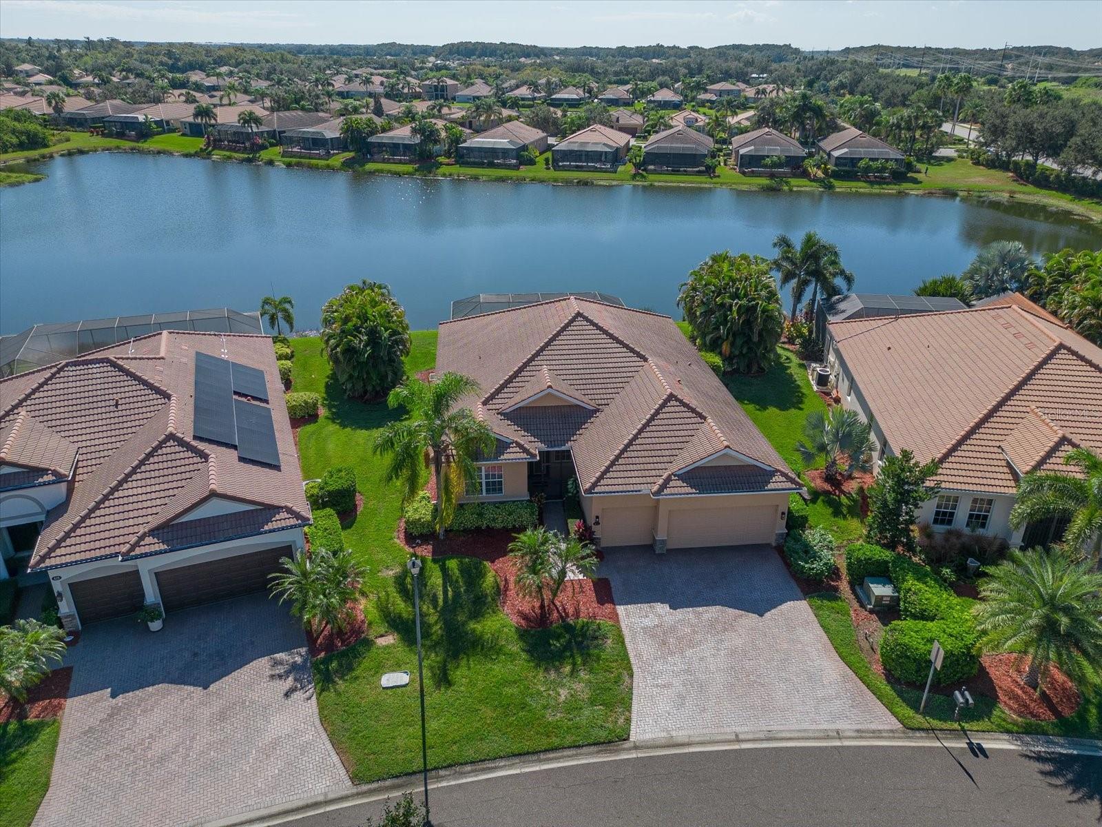 Drink in this south facing water view and you will instantly fall in love!  River Strand Golf and CC included membership home - where 27 recently renovated holes await - along with tennis, pickleball, resort-style pool an active clubhouse with restaurant and bar - so many things to love about the lifestyle presented here - start creating your own memories as you'll hardly need to leave the gated community!  Recently renovated kitchen with hand selected quartz counters and induction top range await - and entertainment is a snap with convection wall over and microwave just installed as well.  High-End Luxury Vinyl sits atop the living spaces and recently painted inside enhance the light and bright look!  The recently resurfaced pool and spa also has a brand new pool pump and sits on the shore of a vast pond with preserve to the east - all day sun awaits during Florida's famous "season" as well - exactly what you've been looking for.  This 3 bedroom 2 bath PLUS Den floorplan is awesome for the "work/study" from home lifestyle so common today and features a 3 car garage as well - all you need to do is bring the sticks, racquets, fishing poles and swim trunks and start living the River Strand lifestyle!  Close by are many retail shops including Costco, Aldi, Publix and the ever growing culinary options offered to East County residents along with quick access to I75 should you need to explore the Suncoast.  Famous Florida Beaches aren't too far away as well.  CDD included in total taxes.
