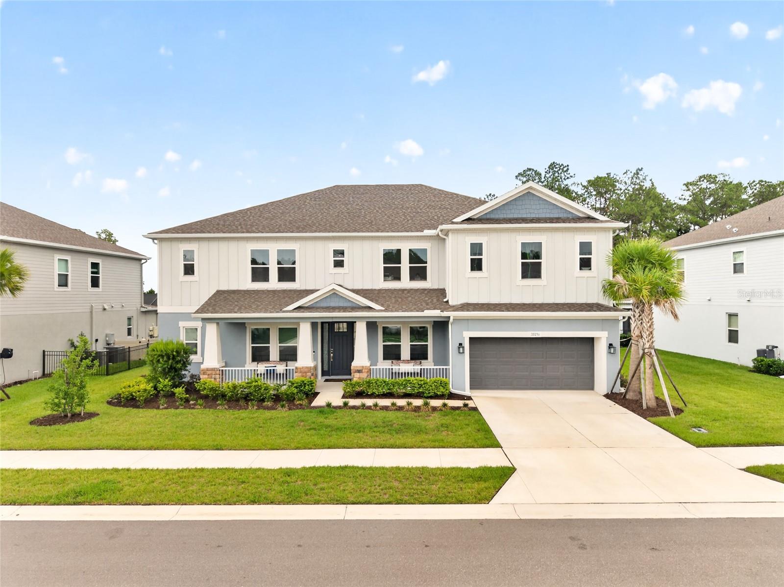 Looking for a 7-bedroom pool home in Wesley Chapel, FL with a pond and conservation view? This 2024 Taylor Morrison Tradewind floor plan in the highly sought-after River Landing community delivers 4,823 square feet of thoughtfully designed living space, offering the space and flexibility today's buyers are searching for, and close to the community amenity center.
This exceptional home features 7 bedrooms and 4 bathrooms across a layout built for both everyday living and effortless entertaining, plus a 2-car garage. TWO bedrooms are located downstairs, including a spacious primary suite retreat with a spa-inspired en-suite bathroom featuring a soaking tub and a separate walk-in shower — the perfect place to unwind at the end of the day. Upstairs, five additional bedrooms offer plenty of room for family, guests, or a growing household, each thoughtfully placed for privacy and comfort. This flexible layout is ideal for multi-generational living, hosting guests, or simply spreading out in style.
As you enter, a formal dining room at the front of the home welcomes guests with an elegant, dedicated space for hosting holidays and special occasions. Toward the rear, the true heart of the home unfolds: a large eat-in kitchen that easily accommodates a table for 10, flowing seamlessly into an open family room that overlooks the backyard — ideal for everyday living, casual meals, and entertaining while keeping an eye on the pool and conservation views beyond.
Need even more space to work, play, or unwind? This home delivers: a dedicated home office for productivity, a movie/media room for family nights in, and a bonus/flex room ready to become a playroom, home gym, or second living area — the possibilities are endless.
At the center of it all is a chef-inspired kitchen that's a true showstopper. It features a 6-burner gas range, an industrial-style range hood, a double oven, a built-in microwave, and a farmhouse stainless steel sink. Tile backsplash, ample cabinet and drawer storage, and a pantry round out this highly functional culinary space, designed for cooking, gathering, and everything in between.
Step outside to experience true Florida living. The expansive screened lanai, finished with beautiful pavers, overlooks panoramic pond and conservation views — offering privacy, natural beauty, and no rear neighbors. Take a dip in the sparkling private pool or simply relax outdoors and soak in the serenity of your own backyard oasis, all visible right from the family room and kitchen.
Residents of River Landing enjoy access to The River Club, the community's resort-style amenity center featuring a zero-entry pool with spa, a covered fire pit area, a fully-equipped fitness studio, tennis courts, a sports field, scenic walking and biking trails, a dog park, playgrounds, and a large clubhouse perfect for socializing and community events. It's Florida living that truly feels like a vacation, every single day.
Located in one of Wesley Chapel's most desirable new-construction communities, this home is just minutes from Wiregrass Mall, Tampa Premium Outlets, top-rated schools, and offers easy access to I-75 for an effortless commute to Tampa. This is new construction living — without the wait. Homes offering this combination of space, layout, and views in River Landing don't come along often. Schedule your private showing of 33751 Landsman Loop today and experience it for yourself.