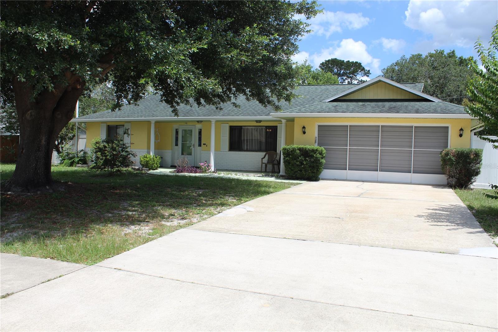 Large lot with NO HOA! Bring your boat, RV, trailer, and toys—there's plenty of room to park them all. This 2-bedroom, 2-bath Deltona home offers great bones and major updates already completed, including a roof approximately 4 years old, A/C less than 2 years old, and a newer whole-house water softener and filtration system. Inside, you'll find high ceilings that create an open and spacious feel throughout the home. The kitchen features a convenient breakfast bar and plenty of potential to make it your own. Both bedrooms include ceiling fans for added comfort. The primary suite offers a walk-in closet and private en-suite bathroom with a walk-in shower, while the guest bathroom features a full-size bathtub. Step outside to enjoy the large fenced backyard complete with two storage sheds, a spacious screened-in patio, and an extended concrete pad—perfect for entertaining, relaxing, or additional outdoor storage. Conveniently located near shopping, dining, schools, and major highways. This home presents an excellent opportunity for a first-time homebuyer looking to build equity or an investor seeking a strong rental property. Don't miss your chance to unlock this home's full potential.