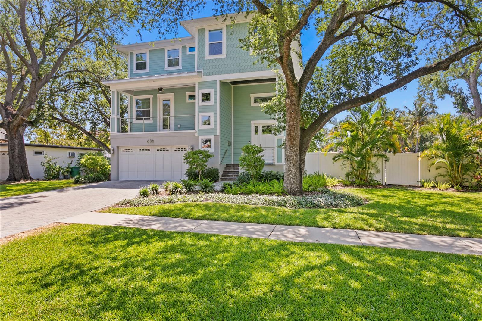 Newer Davis Islands Waterfront Home situated on over a 1/4 Acre Canal Front Lot, leading out to Tampa Bay! The home has a very functional layout: 4 Bedrooms, 4 Full Bathrooms, 1 powder bathroom, Office + Bonus Room/Loft. The extraordinary outdoor space thoughtfully crafted includes a saltwater heated pool/spa/sunshelf w/sheer waterfalls that pour out of the fire feature, a putting green, an outdoor kitchen as well as a fully turfed oversized lawn. The entire 1st floor is garage (room for 5 cars) with an Elevator to the 2nd and 3rd levels. The 2nd floor holds an open great room/kitchen/dining room layout w/Nano doors leading out to a covered deck. This level also includes a guest bedroom suite, office & powder bathroom. The primary suite encompasses the entire width of the 3rd level with its own private balcony. The additional 2 bedroom suites and loft/bonus space round out the 3rd level. A whole house generator, smart house automation and new AC units were recently added. Davis Islands is conveniently located just beyond Downtown Tampa, Channelside, Sparkman's Wharf and Harbour Island. Also, just a quick golf cart ride away from Hyde Park Village. DI is also home to Davis Island's Yacht Club, a small sandy beach, a large waterfront park, an array of shops & restaurants, a playground, tennis courts, baseball fields, public pool (newly redesigned with "splash area"), dog parks, boat ramp and small private pilot airport (FBO). Gorrie/Wilson/Plant school district.