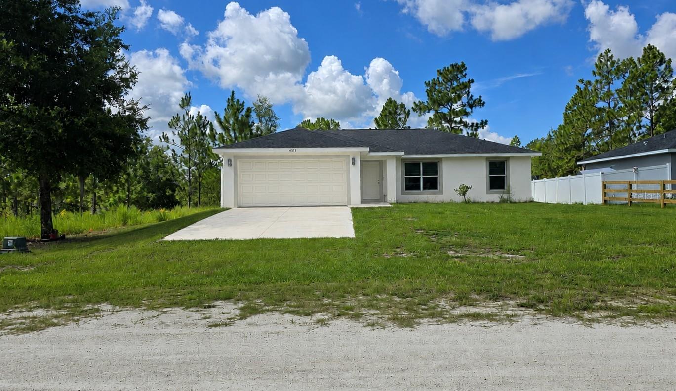 Beautiful 3-bedroom, 2-bath home situated on a spacious 0.23-acre lot, offering the perfect setting to enjoy the Florida lifestyle. The oversized backyard provides endless possibilities to create your dream outdoor oasis, whether it's a custom pool, summer kitchen, entertainment area, or beautifully landscaped garden.

Inside, you'll find an open and functional floor plan featuring vaulted ceilings in the main living areas, luxury waterproof vinyl plank flooring throughout, and a modern kitchen with solid wood soft-close cabinetry, elegant quartz countertops, and stainless steel appliances, including a dishwasher.

Additional features include a fully equipped laundry room with direct access to the attached two-car garage, an automatic garage door opener, recessed lighting, and ceiling fans throughout the home.

Located in a quiet and growing area of Ocala, this property is approximately 10 miles from the renowned World Equestrian Center and offers convenient access to major highways, shopping, dining, and everyday amenities.

Thoughtfully designed with modern finishes and exceptional outdoor potential, this home is an excellent opportunity for buyers seeking comfort, style, and the tranquility of Ocala living.Schedule your showing today!