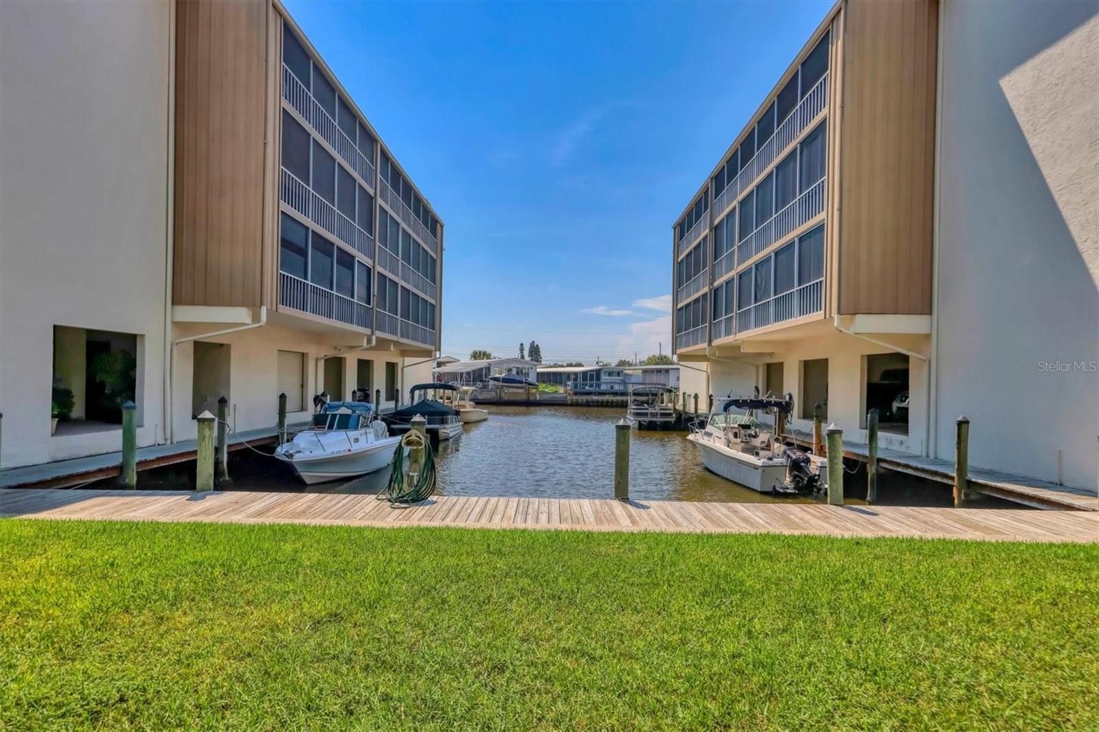 Bring all Offers! Seller will include one- year paid HOA dues with a reasonable sales price.
A Boater’s Dream on the Water!   Turnkey Furnished unit — This 2-bedroom, 2 Bathroom Condo shows like a MODEL HOME! 
You won’t find a better value in Manatee or Sarasota County to dock your boat right outside your condo! Assigned dock space is available.
— an incredible deal.
This completely modernized waterfront condo offers direct access with no bridges to Sarasota Bay and the Intracoastal Waterway. The owner spared no expense in creating a stunning, move-in-ready home. The entire unit was fully remodeled down to the studs, featuring new plumbing and electric wiring, outlets, and lighting fixtures.
The electrical panel was relocated which allowed for an expansive island—perfect for entertaining friends and family.
The kitchen is a chef's dream, it features hardwood cabinets, quartzite countertops with a beautiful leathered finish, pull-out drawers, stylish wet bar, and top-of-the-line stainless steel appliances, oversized kitchen sink with commercial faucet. 
The spacious Master Bedroom suite includes a walk-in closet,  and sliding glass doors leading to your private lanai with water views.
The en-suite bathroom showcases a walk-in shower and modern finishes  and floor to ceiling porcelain tile. The second bedroom is versatile, featuring a cabinet bed for use as both an office and a guest room. The hall bathroom boasts a sleek floor to ceiling porcelain tiled design and a modern bathtub.
Enjoy the outdoors from your 35-foot-long lanai which features tinted vinyl panels to block out the  rain and wind. This unit has tons interior storage with additional storage on the lanai and a first floor storage locker.
Additional updates include a new water heater (installed in 2021) and HVAC system (installed in 2019). Elegant 24" x 48" high-end porcelain tile flows throughout the home.

Laundry rooms are conveniently located on every floor.  Elevators make
it easy to access the unit and garage parking is available for an extra monthly fee.
and there is ample free outdoor parking.  

Located 3 miles from to Sarasota International Airport, and minutes from University Town center Mall, Restaurants, and our Beautiful Florida's beaches .
Located on a  short canal ride straight to the wide-open waters  of Sarasota Bay — where you can see the Ringling Bridge as you  approach!            In just 10–15 minutes by boat, you’ll find some of Sarasota’s 
most popular waterfront dining spots, including Marina Jack’s, The Salty Dog, 
and Dry Dock. Headnorth to the crystal-clear waters of Jewfish Key for a
 perfect sandbar day, or continue on to Cortez for live music and fresh seafood at
local favorites like The Swordfish Grill, Cortez Kitchen, or Star Fish
Company.
For the avid angler, this location provides unbeatable Gulf access—head north 10 minutes through New Pass, or south 15 minutes to
 Longboat Pass for a direct route to open waters. Sarabay Coves truly offers the most convenient, centralized boating access in Sarasota and Manatee Counties.

The HOA fees include internet, cable, water, sewer, trash, pool,
jacuzzi, clubhouse, tennis courts, building insurance, flood
insurance, common area liability insurance, and professional
management.
Great Investment property! Rent 12 times a year 30 day minimum and
pets are welcome. Sarabay Cove is truly a Hidden Gem waterfront
Community!