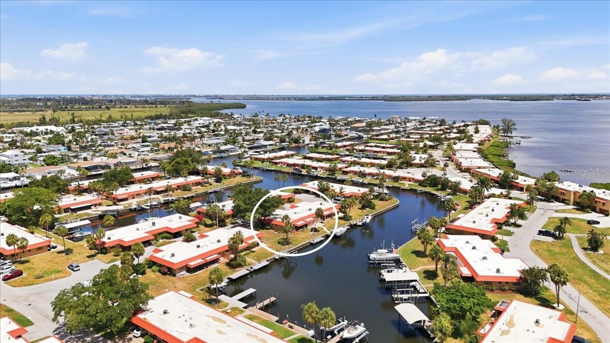Experience the best of coastal Florida living in this 2-bedroom, 2-bath canal-front condo, ideally positioned for those who want effortless access to the water, the beach, and the laid-back island lifestyle. Set along a peaceful canal that leads directly out to Palma Sola Bay, this residence offers a rare opportunity for boating, paddleboarding, kayaking, and enjoying the waterfront right from your backyard. From Palma Sola Bay, boaters can easily connect to some of the area’s most loved waterways, making this an incredible location for anyone who wants quick access to the Gulf Coast lifestyle. Inside, the condo offers a bright and inviting layout with luxury vinyl flooring, beautiful natural light, and large windows that frame peaceful canal views. The renovated bathrooms add a fresh, elevated feel, while the living spaces offer comfort, ease, and everyday functionality. Located just 1.5 miles from Anna Maria Island and its world-famous beaches, this condo puts you close to everything that makes the area so desirable — beach days, waterfront dining, boutique shopping, local restaurants, boating, biking, and golf cart-friendly exploring. The community itself adds to the lifestyle, with a relaxed, easygoing setting where biking and golf carts make it simple to enjoy nearby attractions. The association offers an impressive lineup of amenities, including a community pool, sauna, fitness center, clubhouse, banquet room, storage shed, landscaping, and exterior grounds maintenance — giving you a low-maintenance, stress-free way to enjoy life near the water. Cable and Wi-Fi are also included in the HOA payment. For those looking for flexibility, the condo may be rented with a one-month minimum up to three times per year, making it a great option for seasonal use, a second home, or a coastal investment opportunity. A quote for a potential boat lift installation has already been obtained and can be provided upon request, offering added value for buyers looking to maximize the waterfront lifestyle. Whether you are searching for a full-time residence, vacation retreat, or low-maintenance coastal getaway, this canal-front condo brings together location, lifestyle, and convenience just minutes from Anna Maria Island.