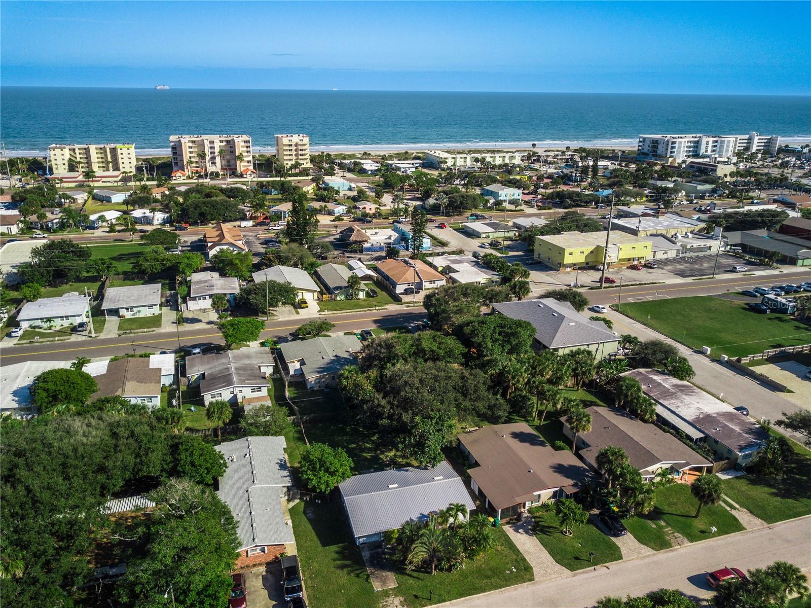 3-bedroom, 2-bathroom (1440 square of indoor space) home in the heart of Cocoa Beach!  

No HOA.

COMPLETELY REMODELED with new floors, new bathrooms new plumbing, new electrical panel and a new metal roof.

This single-story home offers 1,140 sq ft of heated/cooled living space with an additional 1-car garage and utility room (total building area ~1,440 sq ft).   The garage space is versatile and could easily function as a 4th bedroom, home office, or bonus room.   The home also has a spacious Utility Room / Pantry.  

Step outside to a spacious private lot with a large backyard featuring a deck, mature fruit trees, and plenty of room to entertain or relax. The front yard provides generous off-street parking for 3–4 cars plus a 20ft boat or RV.   

Just a short walk to beachfront access, this prime central Cocoa Beach location puts you steps from the sand and near popular spots like Slow N Low Bar-B-Q, Pig & Whistle, and Coconuts on the Beach. Enjoy the best of Cocoa Beach living — restaurants, bars, and the ocean are all within easy walking distance.

Don’t miss this rare opportunity in an excellent downtown Cocoa Beach neighborhood!