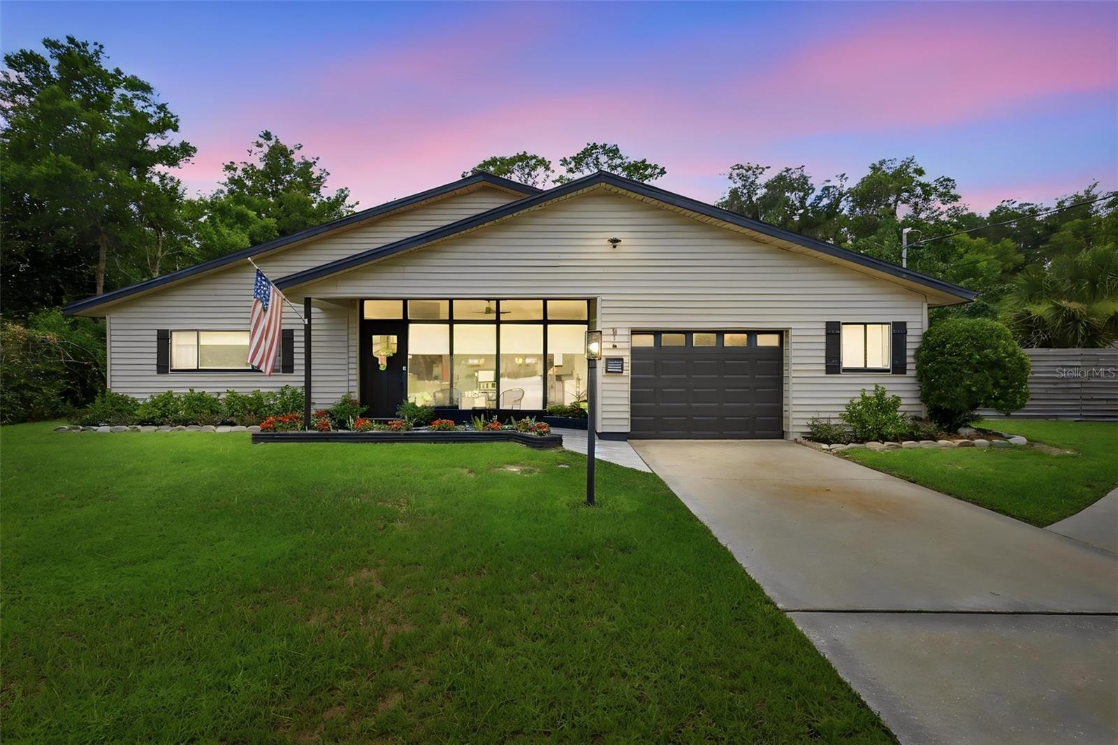 Resort-style living meets multigenerational flexibility in this one-of-a-kind custom DeLand home. Offering 3,274 square feet of heated living space (3,654 total square feet), this exceptional property has been thoughtfully maintained and updated with a new roof (2018), water heater (2023), and pool pump (2024), providing peace of mind for years to come.
The main residence features 3 bedrooms and 2 bathrooms, soaring vaulted ceilings, abundant natural light, and an inviting floor plan designed for both everyday living and entertaining. Enjoy separate living and dining rooms, along with an open-concept kitchen overlooking the family room, where a beautiful white brick wood-burning fireplace creates a warm and welcoming focal point.
The beautifully updated kitchen offers quartz countertops, custom cabinetry, stainless steel appliances, a large center island with seating, and ample storage, making it equally functional and stylish.
Connected to the main home through the laundry room, yet offering its own private entrance, the 1-bedroom, 1-bath in-law suite features vaulted ceilings, a comfortable living area, a kitchenette, and a full bathroom. Whether used for multigenerational living, extended guests, a private home office, or additional living space, this suite provides exceptional flexibility.
Step outside to your own private backyard oasis. The home's unique courtyard design surrounds a sparkling in-ground pool and spa, creating a true resort-style setting. Expansive paver decking provides plenty of space for entertaining, while the fully fenced backyard also features a dedicated fire pit area, perfect for relaxing and enjoying Florida evenings with family and friends.
Originally built in 1960 and thoughtfully expanded and updated in 1990, this home seamlessly blends timeless character with modern convenience. Conveniently located just minutes from historic Downtown DeLand, Stetson University, shopping, dining, parks, and medical facilities, this truly unique property offers an opportunity that rarely comes to market.
All information contained herein is deemed reliable but not guaranteed. Buyers and buyers' agents are encouraged to verify all information, including room dimensions, square footage, zoning, schools, and any other details deemed important to the purchase.