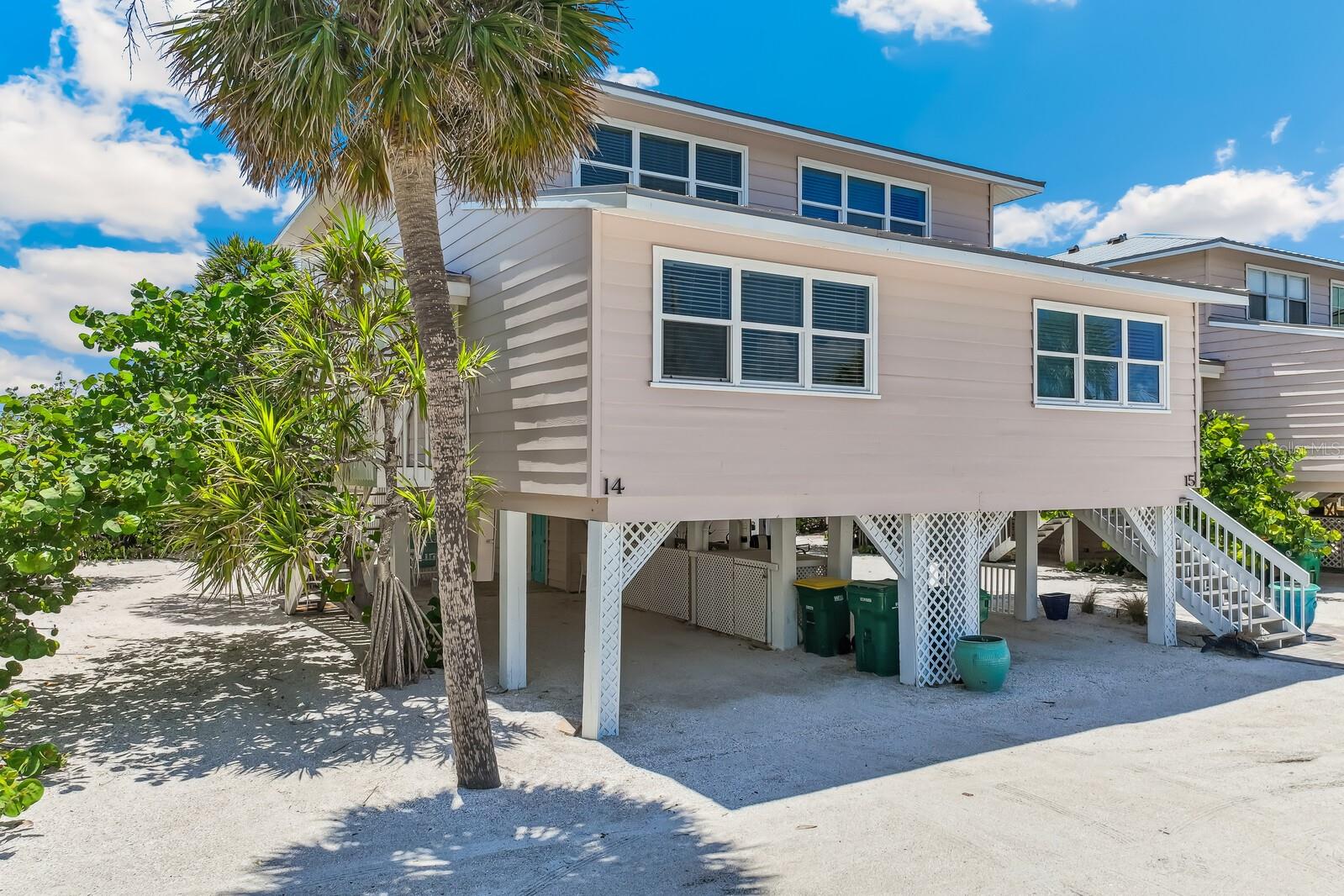 BEACH LOVER'S DREAM IN BOCA GRANDE Imagine waking up to the gentle sound of waves and breathtaking Gulf views right from your window. This charming 3-bedroom, 2-bathroom townhouse offers 1,408 square feet of beachfront living at its finest. Just steps from the sand, this turnkey property lets you embrace the coastal lifestyle immediately. Enjoy your morning coffee on the screened porch while watching dolphins play in the Gulf waters. The townhouse has a new roof, a newly installed HVAC system, updated flooring, and new appliances that add modern convenience to this beach retreat. With an open floor plan and three bedrooms there is ample space for family and friends. Location? Simply perfect! A short golf cart ride delivers you to the Historic Village of Boca Grande with its charming shops and restaurants. Beach enthusiasts will appreciate the direct beach access – no streets to cross, just a sandy path leading straight to paradise. The lower level offers a large, shaded area to congregate after fun at the beach, for grilling, or golf cart or car parking. The townhome has a robust rental history that makes this an attractive investment opportunity when you're not enjoying it yourself.