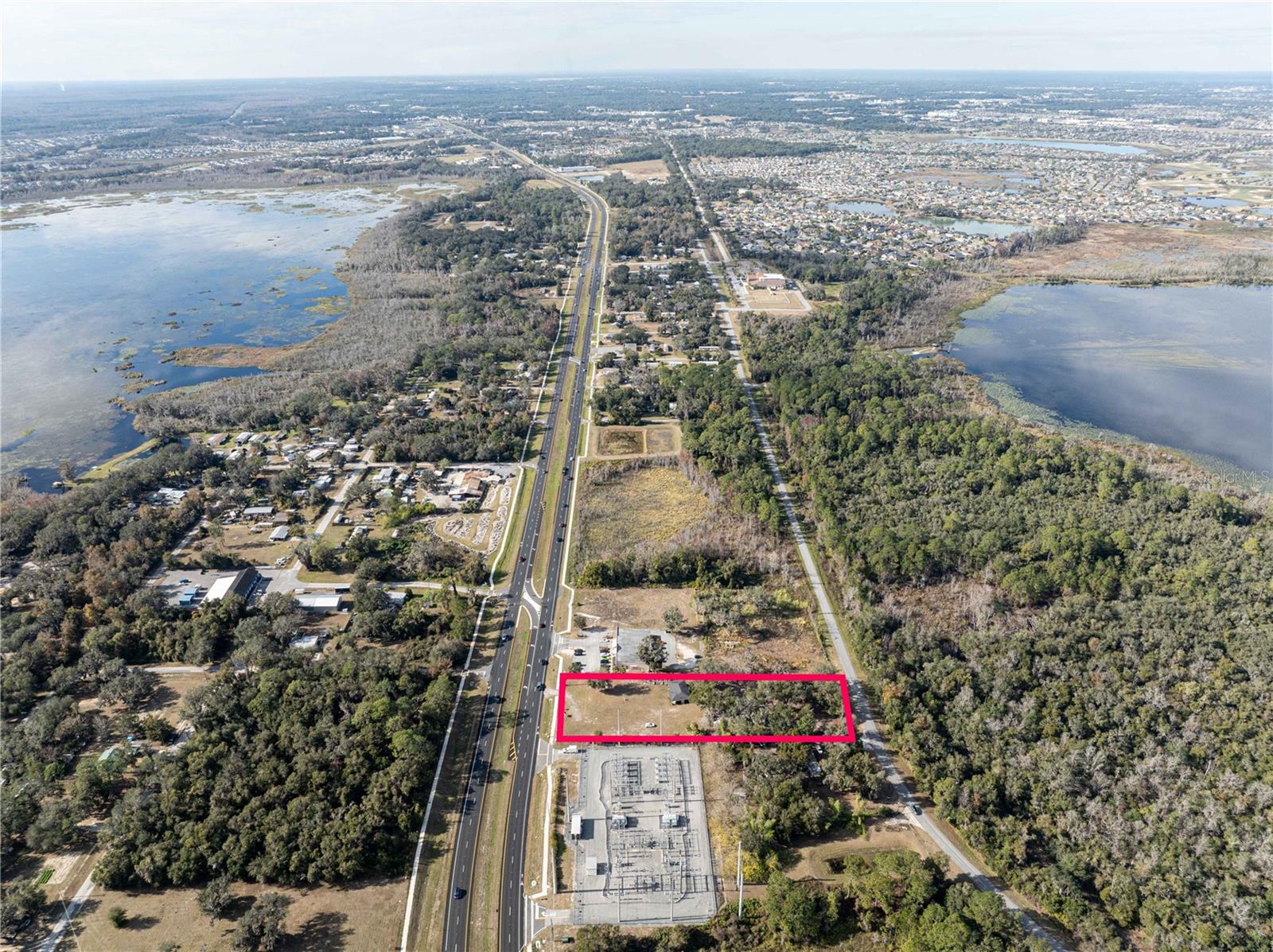 This prime 1.6-acre commercial property is strategically located on State Road 44, just west of Morse Boulevard, in the heart of The Villages & Wildwood’s rapidly growing business corridor. Zoned for Light Commercial use by Sumter County, the site features a 1,200-square-foot office building converted from residential to commercial use. The office space is move-in ready and includes a welcoming lobby, a kitchen, a handicap-accessible bathroom, and two private offices, making it an ideal space for a variety of business operations.One of the standout features of this property is its dual road frontage, offering approximately 150 feet of frontage on both State Road 44 and Wesleyan Way at the rear. This dual access ensures excellent ingress and egress, making it convenient for customers and deliveries alike. Additionally, the property benefits from high traffic volume along State Road 44, which enhances visibility and accessibility for businesses looking to establish themselves in a thriving area.Located between Buena Vista Boulevard and Morse Boulevard, this property is in close proximity to The Villages, one of the fastest-growing communities in Florida. The Villages’ continuous expansion has spurred significant commercial growth, with new businesses, retail centers, and a planned Walmart Supercenter at the intersection of State Road 44 and Morse Boulevard further increasing the area’s economic appeal.With its prime location, excellent accessibility, and move-in-ready office space, this property presents an outstanding opportunity for businesses seeking to capitalize on the growth and commercial potential of the area. Don’t miss out—contact us today to schedule your private showing!