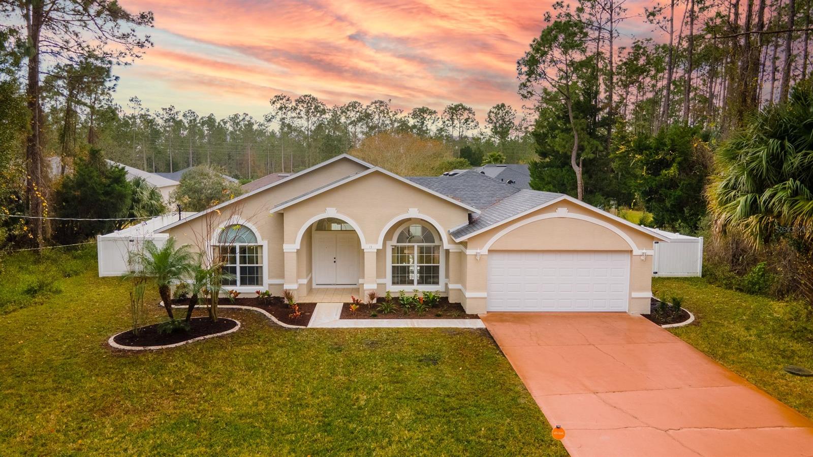 Palm Coast, FL Living with no HOA nestled in a cul-de-sac. Newly updated 1,786 Sq. Feet 3 bedroom 2 full bath 2 car garage on nearly 1/4 acre lot with Brand New roof completed October 2020. New interior and exterior paint and updated landscaping. Completely fenced in backyard with a small fire pit. Vaulted ceilings give this home a feeling of more space. Tile and wood laminate floors throughout the home make it easy to maintain. The primary bedroom and bathroom give a spa-like feel with walk-in closet and built-in jetted tub. Sliding glass doors lead to the back patio from both the living room and family room. Vivint security system and front door video doorbell already in place with security camera and home automation for the Air conditioning and irrigation system. The home has been pre-wired with a generator hook up in the garage for storm emergency and loss of power. Utility sink in the garage with Linear quiet close door with an exterior keypad. Newer AC installed June 2018. Newer water heater. Epoxy paint on the garage floor. Buyer to verify all information. All info deemed accurate but not guaranteed. See this home today! ;Water: City