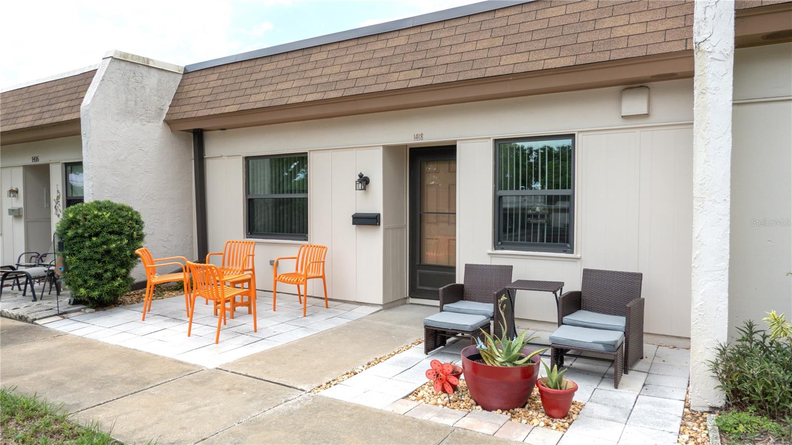 SPECTACULAR RENOVATIONS make this stunning villa-style condo a true showpiece in the sought-after 55+ Mission Hills Community! Modern style with everyday comfort in a move-in-ready home you'll be proud to own. From the moment you arrive, you'll appreciate the beautifully landscaped front entry featuring a brand-new paver patio with a decorative stone centerpiece, the perfect spot to enjoy peaceful sunrises overlooking a park-like setting. QUALITY CRAFTSMANSHIP is evident throughout with all-new double-pane windows and exterior doors, creating an inviting sense of security and efficiency. Inside, the spacious open floor plan is enhanced by fresh interior paint, luxury vinyl plank flooring, oversized baseboards and trim, new interior doors and hardware, updated lighting, ceiling fans in every room, and new blinds throughout. The GORGEOUS REIMAGINED KITCHEN is the heart of the home, showcasing solid wood Shaker cabinetry with 42-inch upper cabinets and crown molding, a Lazy Susan, quartz countertops, recessed and pendant lighting, a convenient coffee bar with additional cabinetry, and a full suite of new stainless-steel appliances covered by a transferable 5-year warranty, including a range with a center grill/griddle burner. The thoughtfully designed split-bedroom floor plan offers privacy with the guest bedroom at the front of the home. The SPACIOUS PRIMARY SUITE, tucked away at the rear, is complete with a walk-in closet and private access to the BEAUTIFULLY UPDATED BATHROOM featuring a new vanity, updated fixtures and lighting, and a stunning tiled walk-in shower with built-in shelving and new plumbing behind the walls. A stackable washer and dryer vent directly outside for added convenience. The RADIENT FLORIDA ROOM opens to an expansive brand-new paver patio complete with French drains, elegant stone edging, and solar lighting, creating the perfect outdoor retreat to relax and enjoy spectacular sunsets. Enjoy truly MAINTENANCE-FREE LIVING – the monthly fee covers Basic Cable, Internet/Wi-Fi, Water, Sewer, Trash, Natural Gas, and all exterior maintenance, including the roof, exterior painting, grounds, roads, and the land lease fee. Residents also enjoy ABUNDANT COMMUNITY AMENITIES, including a clubhouse with kitchen and social hall, library/game room, billiards, ping-pong, a large heated pool, shuffleboard courts, and a picturesque picnic area. IDEALLY LOCATED just minutes from shopping, dining, Ruth Eckerd Hall, charming Downtown Safety Harbor, Historic Dunedin, Award-winning Beaches, Tampa & Clearwater Airports, this exceptional home offers the perfect combination of carefree living, outstanding amenities, and an unbeatable central NON-FLOOD, NON-EVAC location. Schedule your private showing today and experience this remarkable Florida residence for yourself!