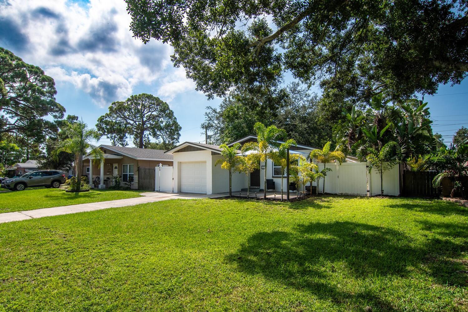Charming Shore Acres Home with 3 beds and 1 and half bathrooms, Fenced, 1 Car Garage.  Ceramic Tile throughout, dual sinks in 2nd bathroom, washer dryer hookup in kitchen closet and gas water heater.  Cute front porch that is covered and side porch with sun shade.  Palm trees landscaping with fenced yard.  Garage has work bench and gas W/H.  Close to shopping, restaurants, Beaches and interstate.  Must see!  Call for easy access.
