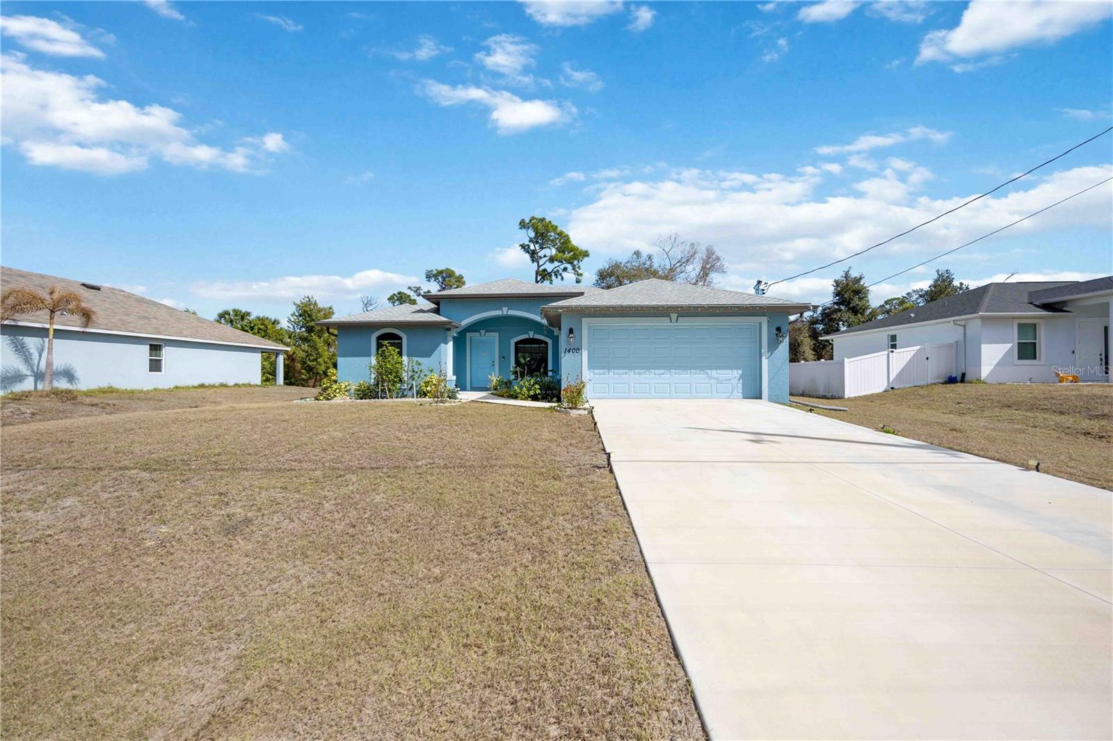 Welcome to this modern single-family home built in 2023 located in desirable North Port, FL. This well-appointed residence offers 1,436 sq ft of living space on a 10,375 sq ft lot, featuring an open floor plan with 3 spacious bedrooms, 2 full bathrooms, and a two-car garage. Designed for comfortable Florida living, the home blends contemporary finishes with functional flow perfect for everyday living or entertaining. The exterior sits on a quiet residential street with newer construction nearby, offering both convenience and neighborhood appeal. Situated in the heart of North Port (34288), residents enjoy easy access to major highways (US-41 and I-75), local shopping, dining, recreation, and the popular North Port Aquatic Center. This prime location also places you within a short drive of Gulf Coast beaches, boating, and outdoor amenities.