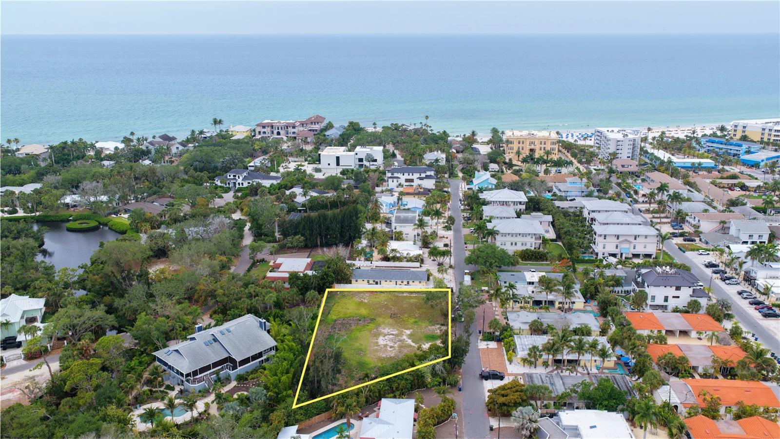 Rare developer opportunity on Siesta Key. This vacant parcel, zoned RMF-1 (Residential Multi-Family), sits on two lots totaling approximately 23,206 sq ft and comes with two professionally designed build options. Option one allows one single-family home and one duplex, each with private pools, covered outdoor living, and 3-car or 4-car garages. Option two features a stunning 3-story boutique condo complex with a resort-style courtyard pool, private cabanas, spacious balconies, and lush tropical landscaping. Additional information and architectural plans for both options are available upon request, please contact the Listing Agent. Located in the sought-after Point of Rocks Terrace neighborhood, just minutes from world-famous Siesta Key Beach — consistently ranked among the best beaches in the country. This is a rare chance to build on one of Florida's most coveted barrier islands.