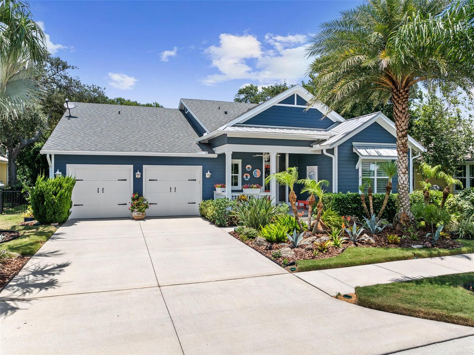 Don’t miss out on this beauty!  RARE and truly one-of-a-kind POOL home in the highly sought-after Beach Haven community right off scenic A1A.  Improvements galore!  With its charming blend of Key West inspired vibes, this stunning residence stands out in the community painted in the distinctive shade of Cape Cod-style navy blue, creating unforgettable curb appeal.  Walking distance to the Atlantic Ocean, residents also enjoy access to a resort-style community pool, outdoor cabana, walking trails, and private beach walkover.  High and dry in Flood Zone X.  Stem wall foundation.  Hurricane storm shutters for all windows. Built in 2017, this 3-bedroom, 2-bath, open concept and well-appointed home also features a newly designed private office niche with a modern, glass panel door—a great space for working from home or managing daily life in privacy, comfort and style. Situated on a larger, premium lot backing to a lush tropical forest filled with palms and majestic oaks, the setting provides exceptional privacy and tranquility.  Relax outdoors and listen to the sound of ocean waves while enjoying your private pool with LED color lights and expansive screen-covered outdoor living area (1100'), with gas connection for outdoor kitchen or grilling under 225’ of covered patio. A free-standing 6-person hot tub is included, creating the perfect space to unwind after a day at the beach. Tropical landscaping in both the front and back yards creates the feeling of a private resort.  No other yard quite like it in Beach Haven. The property is further enhanced by an outdoor shower, sprinkler system, water filtration system, and black aluminum fencing enclosing the backyard providing safety if you have a fur baby.  Inside, you'll find elegant wood-look ceramic tile flooring throughout, a naturalized fossil stone remote gas fireplace, beautiful Cambria quartz kitchen countertops, a coastal inspired glass backsplash, above/under cabinet lighting, 5-burner gas cooktop, crown molding, bead-board accents, shiplap details, custom plantation shutters and light fixtures, a recently added wine and coffee bar, Shelf Genie pullout shelves in kitchen, fresh interior and exterior paint, and a newly painted pool deck. The newly renovated guest bath features an enlarged walk-in shower with ceramic tile, river rock waterfall and flooring accents, and high-end Kohler faucets and hardware. The private primary suite looks out over the lush backyard landscape with a spa inspired bath complete with a free-standing tub, large walk-in shower with river rock, full-length custom mirror/medicine cabinet, and custom designed closet.  For added convenience, select furnishings—including primary bedroom furniture and various main living room pieces—will convey should buyer desire. Every detail has been thoughtfully selected to create a home that is both stylish and functional. The 2-car garage is equally impressive with recent custom built-in cabinetry and durable epoxy flooring.  Garage attic with pull-down stairs contains 12'x20' area for lots of extra storage. This exceptional property shows beautifully and provides a rare opportunity to own one of the community's most distinctive residences.  Whether you are looking for a full-time residence or second home at the beach, don’t let this rare, beautiful pool home get away!  A home with a pool AND premium lot does not come around often in this community.  Don't miss out on this true gem of a home.  Buyer's agents welcome!