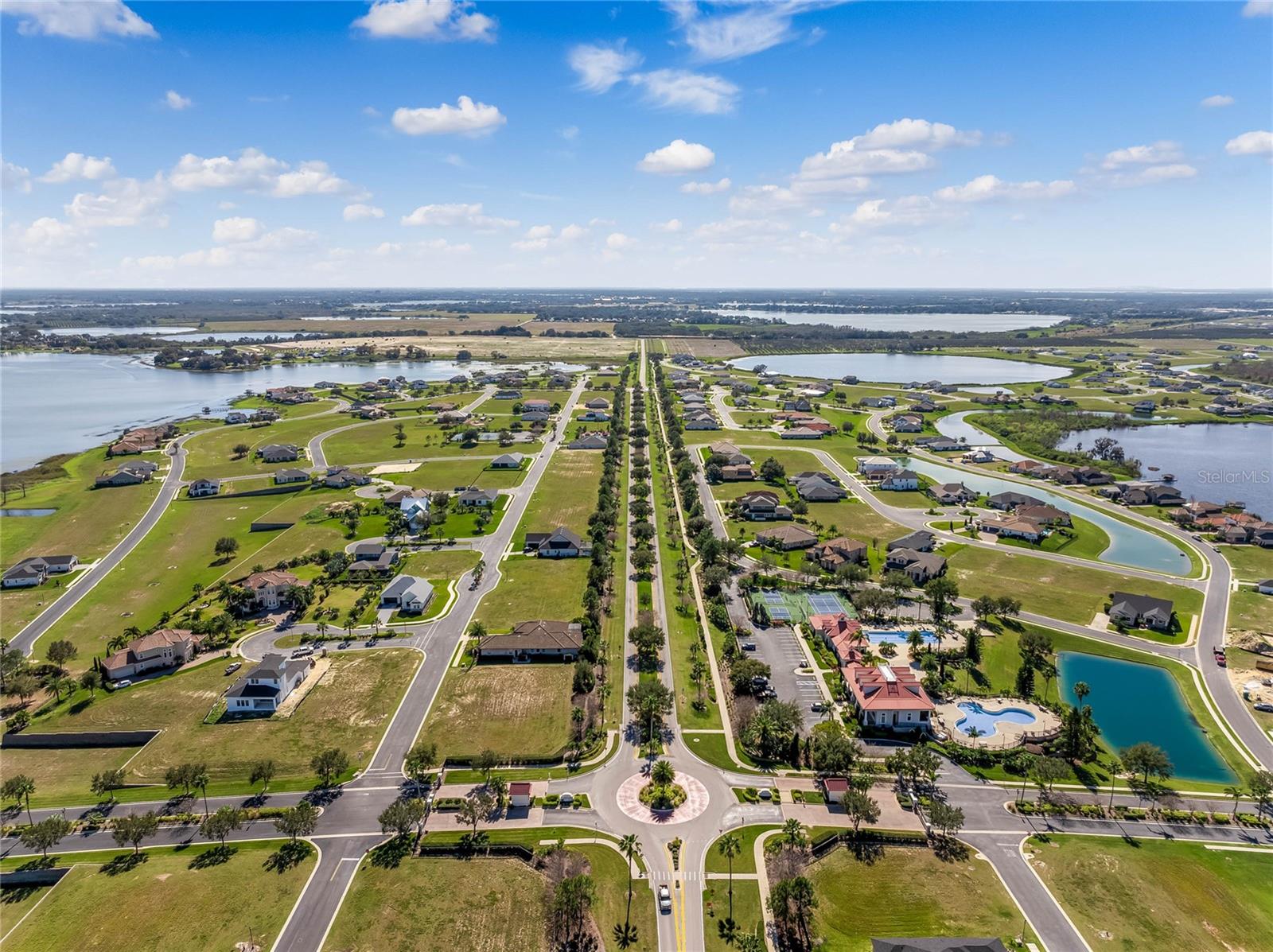 Lakefront building lot in Water Ridge, one of Central Florida’s premier gated resort-style communities. Located at 535 Adams View Lane, this beautiful 0.30-acre lakefront lot offers unobstructed west-facing sunset views over the pristine 595-acre Lake Van—a clear, sand-bottom lake renowned for outstanding largemouth bass and speckled perch fishing, smooth waters ideal for boating and skiing, and even seaplane accessibility. With more than enough elevation for premium views, the property offers endless opportunities to design a custom lakefront residence with sweeping water and sky vistas. All public utilities—city water, city sewer, power, and high-speed internet—are readily available, making this a truly build-ready lot with exceptional long-term value. Lake Van’s shoreline is a haven for wildlife and migratory birds, creating a serene, natural backdrop that evolves beautifully through every season. Water Ridge is one of Central Florida’s most picturesque lakefront communities, perched high on a natural ridge that captures panoramic lake views and cooling breezes. Residents enjoy a full suite of luxury amenities, including a grand clubhouse with fitness center and sauna, three resort-style pools, lighted tennis and pickleball courts, walking paths, a fishing pier, a community boat ramp, and secured storage for boats and RVs. The manicured grounds, lush landscaping, and terraced elevations create a peaceful, upscale atmosphere that sets the community apart. Conveniently located near shopping, dining, Publix, Walmart, medical facilities, and everyday essentials, Water Ridge offers the perfect blend of privacy and accessibility. Nearby Auburndale, Winter Haven, and Lake Alfred provide small-town charm, while golf enthusiasts will appreciate the abundance of courses just minutes away. With quick access to I-4, you’re centrally positioned between Orlando and Tampa, world-class attractions, international airports, and Florida’s Gulf and Atlantic beaches—all within easy reach. Whether you’re planning a full-time residence, seasonal retreat, or a smart investment in Florida’s booming lakefront market, this property offers unmatched beauty, amenities, and potential. 535 Adams View Lane is more than a lot—it’s the foundation for an extraordinary lakefront lifestyle in one of Central Florida’s most prestigious communities.