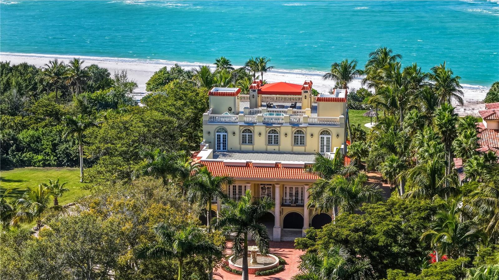 Positioned on the pristine shores of Sarasota’s Lido Key, 1067 Westway Drive presents a truly rare Gulf-front offering—defined by scale, privacy and irreplaceable land value. With over 100 feet of private, direct beachfront, this estate occupies one of the most coveted and increasingly scarce stretches of shoreline on Florida’s West Coast. Parcels of this size are rarely found, positioning this property as both a refined coastal retreat and a generational asset.

Designed to embrace its extraordinary setting, the residence unfolds with light-filled interiors, grand architectural moments and uninterrupted turquoise Gulf views from nearly every living space. A dramatic atrium entry and marble staircase lead to expansive rooms where soaring ceilings, bespoke detailing and walls of glass blur the line between indoors and out. The welcoming great room opens effortlessly into an expansive beachfront terrace - offering front-row views of endless sunsets over the Gulf of Mexico.  The home is equally suited for elegant entertaining and relaxed coastal living, featuring a sophisticated bar and lounge with a custom glass wine room, a gourmet chef’s kitchen with premium appliances and multiple dining spaces outlined by panoramic water views. Savor resort-style outdoor living - and soak up the sun with unlimited boating, water sports and beachcombing.  Experience the lush, tropical landscaping, infinity-edge pool overlooking the Gulf, and multiple rooftop terraces - culminating in a spectacular rooftop entertaining level with sweeping sunrise-to-sunset vistas spanning Sarasota Bay, downtown and the Gulf beyond.  The primary suite is a dedicated sanctuary with its own beach-front terrace, spa-inspired bath, boutique-style dressing room and fitness space.  Artfully designed for both the owner’s privacy as well as those who visit – the five guest suites are thoughtfully appointed as intimate retreats.  And while famous St. Armands’s Circle and vibrant downtown Sarasota is merely minutes away for dining and shopping – there’s no need to leave the grounds when you have a private theater, 2 executive offices, fitness room, family and game rooms, bunk room and multiple rooftop decks for lounging and entertaining.  

Offering exceptional Gulf of Mexico frontage, uncompromising privacy and a world-class beachfront lifestyle, 1067 Westway Drive stands among the most significant residential offerings on Florida’s Gulf Coast—an estate where luxury, location and legacy converge.  (Two adjoining parcels are available to design one of the most private retreats in South Florida.)