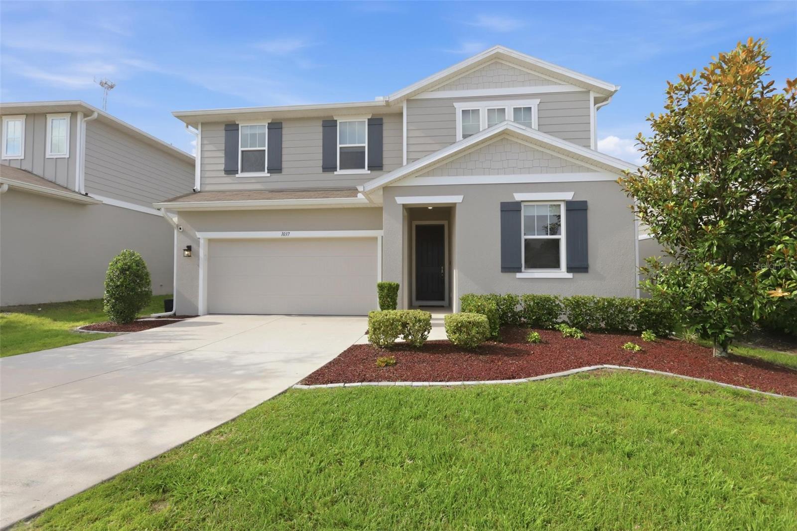 Welcome to this beautifully upgraded 4-bedroom, 3-bathroom two-story home in the desirable Seasons at River Chase community. Better than new, this meticulously maintained residence offers an impressive list of thoughtful enhancements designed for comfort, convenience, and modern living.

Enjoy peaceful conservation views from the fenced backyard, featuring a charming white vinyl picket fence with gated access on both sides and the rear of the property. The outdoor space is perfect for relaxing or entertaining, complete with solar-powered market lighting and plenty of room to enjoy the natural surroundings.

Inside, the open-concept floor plan is filled with natural light and showcases a spacious kitchen featuring quartz countertops, a large center island, and stylish white cabinetry. Sliding glass doors lead to the covered lanai, creating seamless indoor-outdoor living. A first-floor bedroom and full bath provide flexibility for guests, multigenerational living, or a home office.

Upstairs, the spacious primary suite offers a custom-designed walk-in closet, dual vanities, and a private water closet. Two additional bedrooms, a full bath, a generous loft/bonus room, and an upgraded laundry room with butcher block countertops and custom cabinetry complete the second level.

Additional features include ceiling fans with remote controls in every room, blinds throughout with blackout shades in the loft and primary bedroom, motorized blinds in the primary suite and an upstairs bedroom/office, two AT&T Fiber connection locations, and an exterior generator hookup. The HVAC system has been enhanced with a germicidal UV light  and has been recently serviced. Other valuable upgrades include gutters, solar-powered security cameras at the front and rear of the home, and a finished garage with striking stained black concrete floors and custom-built storage shelving.

This exceptional home combines modern style, functional upgrades, and a prime conservation setting—offering a move-in-ready opportunity that truly stands out from new construction.