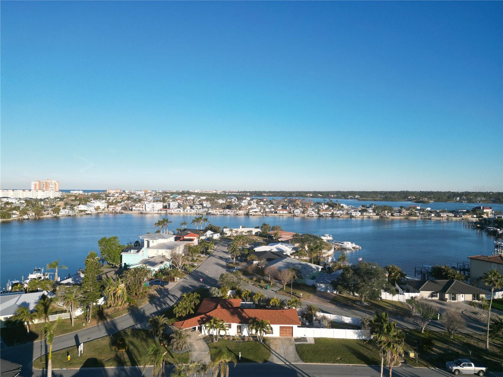 Coastal Paradise at 430 173rd Ave E, North Redington Beach - Discover the perfect blend of luxury and relaxation in this stunning beach home nestled in the heart of North Redington Beach. Situated on a rare and unique homesite adjacent to a serene park, this property offers unparalleled privacy and tranquility—an extraordinary find in this coveted beachside community. This home features a well-thought-out open floor plan, designed to seamlessly accommodate both everyday living and entertaining. The layout includes a spacious primary suite and two additional guest suites for family or visitors, along with two bathrooms. Step outside to your private oasis, where you’ll find a breathtaking resort-style swimming pool and spa, designed for ultimate relaxation and entertainment. Surrounded by lush tropical landscaping, this stunning outdoor retreat provides the perfect setting for soaking up the Florida sunshine or enjoying a tranquil evening under the stars. The adjacent park further enhances the home's charm, offering a lush green space for relaxation, recreation, and additional privacy. Whether you're looking to create your dream home or renovate an existing space, Lord General Contractors is available to assist with all your construction and design needs, ensuring your vision for a luxurious coastal lifestyle is brought to life. Located in a highly sought-after neighborhood, this home is the perfect choice whether you’re seeking a full-time residence, vacation getaway, or investment property. This North Redington Beach gem is an unparalleled opportunity to own coastal paradise. Don’t miss out on this rare island oasis retreat! Schedule your private showing today.