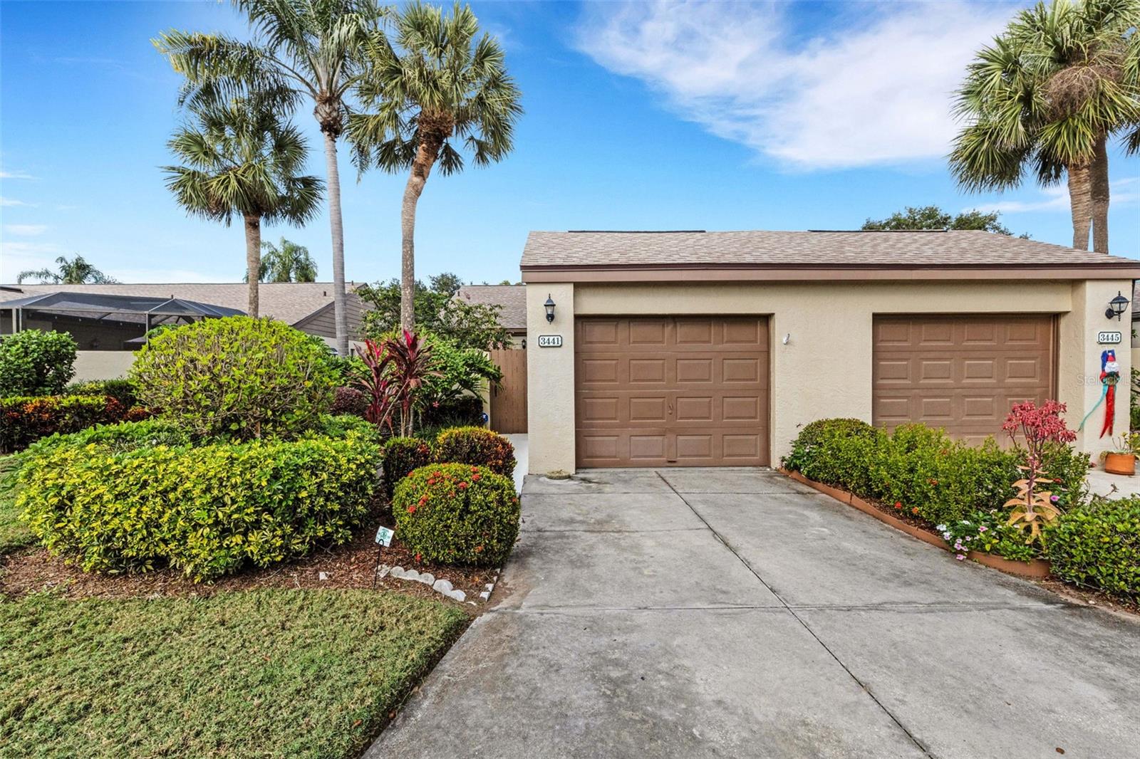 Recently Reduced!
Tucked away in a small, quiet community yet close to all the action near the UTC Mall—where shopping, restaurants, entertainment, and the new Mote Aquarium are right at your doorstep—this 2-bedroom, 2-bath villa offers the perfect blend of convenience and tranquility.  Enjoy front and rear courtyards that create a private tropical paradise for outdoor living, complete with your own lemon tree loaded with fruit. Sliding glass doors to the courtyards from the kitchen, primary bedroom, second bedroom, and living room make these spaces feel like natural extensions of the living areas.  Features include a NEW ROOF (2023), plantation shutters, and Hunter Douglas Vertiglide shades for carefree living. The primary suite has it's own private en suite bathroom and an oversized walk in closet.  A built-in desk with shelving and a queen-sized Murphy bed in the second bedroom give this room the flexibility of an in-home office or guest space. Close the hall pocket door from the living room to convert this area into a private guest suite. The kitchen and bathrooms have been tastefully updated with beautiful countertops and vanities. A convenient laundry area is tucked behind louvered doors in the kitchen. An attached one-car garage with room for storage and a workbench, plus oversized closets throughout the home, provides more storage space than you would expect in a condo or villa. The friendly community offers a clubhouse, tennis and pickleball courts, and a sparkling pool just around the corner.  This home checks all the boxes for enjoying the Florida lifestyle: an excellent location, inviting indoor-outdoor living areas, ample storage, great amenities, and bright, airy rooms made for relaxing. Come and see if this is the right place for you!