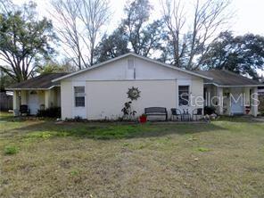 Great investment property! Two units, each with 2 bedrooms and 2 baths! Master bedrooms have walk-in closets and on suite baths. Each have an enclosed laundry room and a covered, screened lanai  that overlooks a large backyard. Unit B has new interior paint throughout plus ceramic tile in the living, dining rooms and kitchen. Minutes to shopping and major highways.