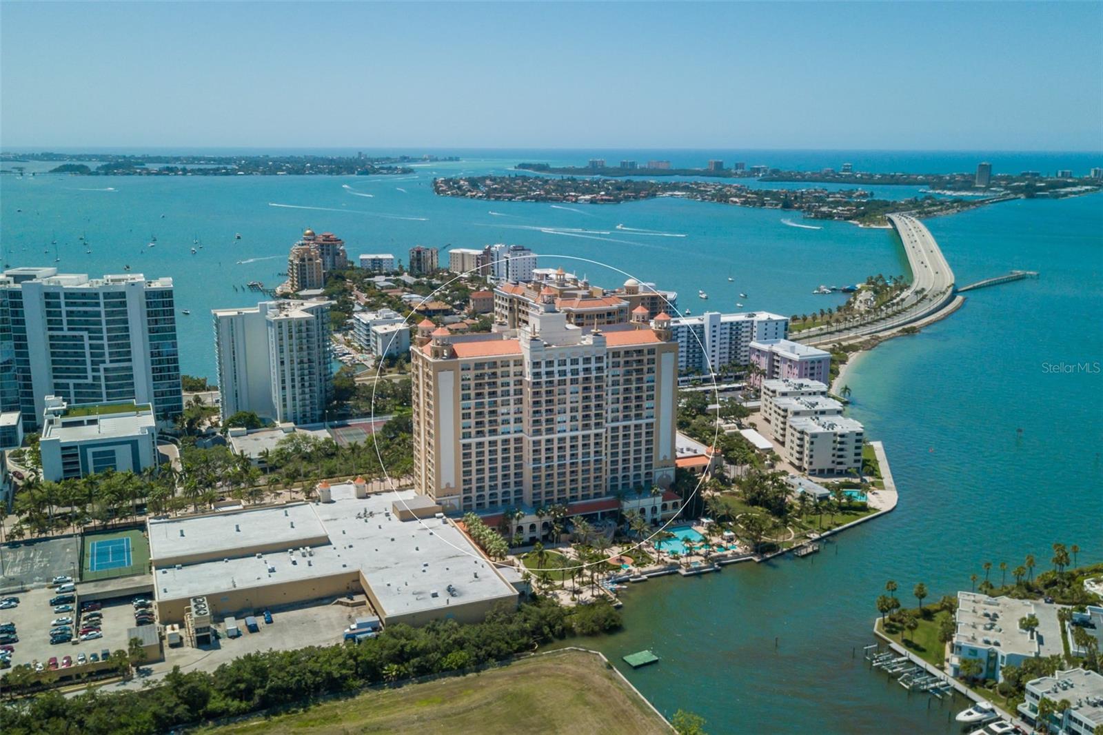 Perched above the sparkling waters of Sarasota Bay, Residence #1205 at The Ritz-Carlton Residences delivers an elevated standard of luxury defined by world-class service, refined design, and an unmatched downtown location. Designed for both privacy and flexibility, this residence features two expansive primary suites—a rare and highly desirable split layout ideal for multigenerational living, hosting guests, or effortless seasonal use. The primary suite is a true sanctuary, finished in marble with a spa-inspired jacuzzi soaking tub and separate shower.  In addition to the walk-in closet, the suite is appointed with custom-designed built in wardrobes. The second suite mirrors this level of comfort with dual sinks and a dedicated makeup vanity area, offering a private retreat for family or guests. Light-filled living spaces open to a generous private terrace, where panoramic Sarasota Bay views and vibrant sunsets create a stunning everyday backdrop. The seamless indoor-outdoor flow is ideal for both relaxed living and elegant entertaining. Ownership includes access to the full suite of amenities at The Ritz-Carlton Sarasota, offering a true hotel-lifestyle experience with 24-hour concierge, valet, in-residence dining, and a newly renovated spa. Residents also enjoy a waterfront pool and sun deck, private boat dock, exclusive residential entry, climate-controlled storage, and private club spaces. Just steps away, enjoy renowned dining within the hotel at Jack Dusty and Rufa, along with the vibrant energy of downtown Sarasota. Ideally positioned near The Quay and The Bay Sarasota, residents are moments from waterfront parks, cultural venues, boutique shopping, and acclaimed restaurants. With two covered parking spaces and a flexible rental policy, Residence #1205 offers both a luxurious personal retreat and a compelling investment opportunity—delivering the very best of Sarasota’s waterfront lifestyle within the iconic Ritz-Carlton brand.