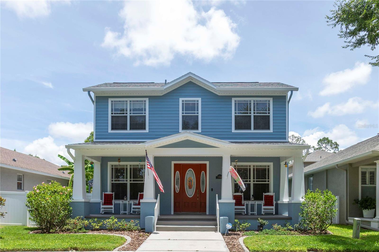 Perfect home for entertaining, whether you enjoy coffee on the spacious front porch, cocktails at the built-in bar on the screened lanai or a barbecue on the double decks. Escape to your own outdoor paradise, once featured in the Tampa Tribune Garden Section. Fenced side yard includes a beach area with shell and a gas fire pit. Palm, banana and citrus trees complete the tropical landscaping. 
The interior of the house is warm and inviting. The eat-in kitchen, with gas range, extra-tall cabinets, island and breakfast bar, opens onto a large family room. For more intimate entertaining, there is a living room and a dining room with crown molding. Large front windows flood the rooms with natural light. A half-bath, primary bedroom/bathroom, and indoor laundry room with LG washer and gas dryer complete the first floor. The renovated master bath has a jetted garden tub and a walk-in shower with dual shower heads. The bathroom leads to a walk-in closet with an abundance of shelving. The second floor contains three bedrooms with large windows and a full bath. There is a two car garage with an extra refrigerator on backside of home plus parking for two additional cars next to the driveway.
The home is located in the traditional neighborhood of Longleaf with an A-rated elementary school, restaurants, tennis and basketball courts, and a pool. A bike path runs behind the house, separating it from a nature preserve. Save on insurance since the home does not require flood insurance. New roof and newly painted exterior in 2024. New A/C and new water softener in 2022.