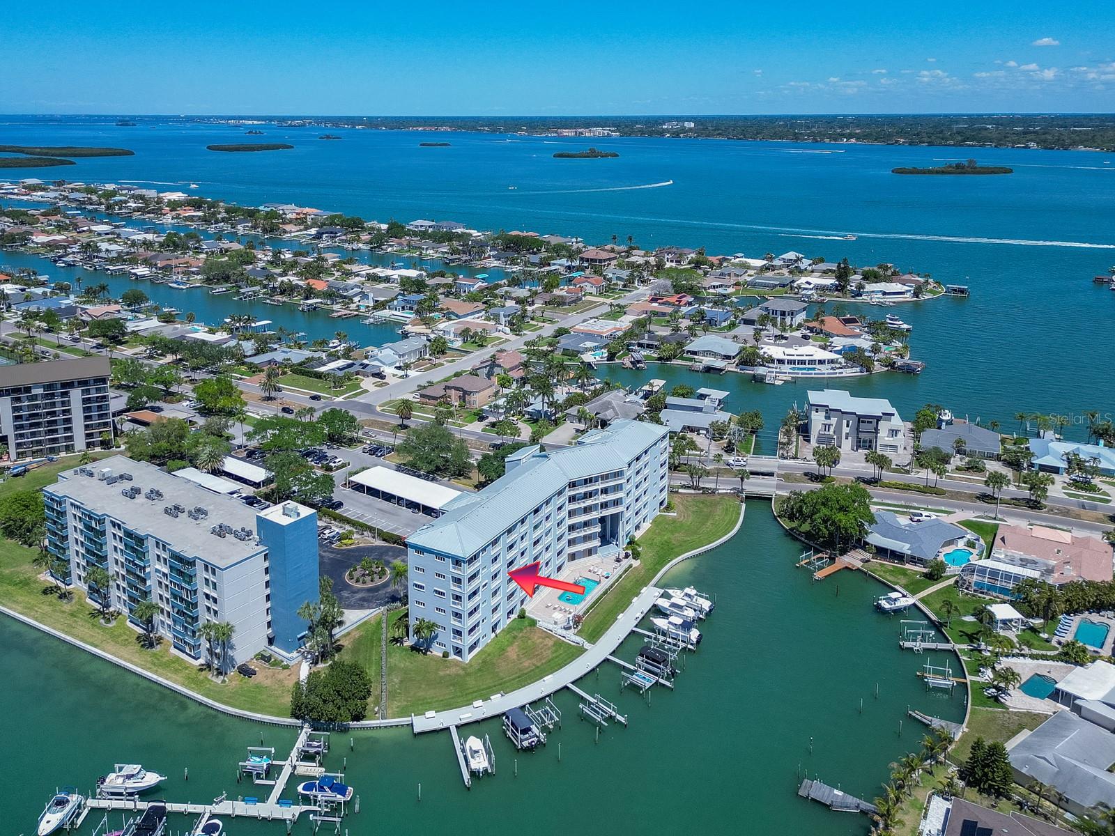Best Priced, waterfront, Clearwater Beach condo! Enjoy the ultimate Island Way lifestyle in this stunning 4th floor waterfront condo at 610 Island Way #407. This move in ready retreat offers breathtaking Intracoastal water views, daily dolphin sightings, and tropical birds right from your window.This meticulously updated residence features brand new Smart LG stainless steel kitchen appliances and a full size stackable LG washer/dryer with steam and wrinkle care. Total peace of mind comes with hurricane impact windows and sliders, re-piped plumbing, and professionally cleaned, encapsulated ductwork. Modern upgrades include fresh interior paint, new ceiling fans, bamboo blinds, updated tiled showers, and recessed kitchen lighting. Relax by the heated saltwater pool overlooking the Intracoastal water, perfect for watching both sunrises and sunsets. The building offers a quiet, private atmosphere with many seasonal owners, a screened entry door with open breezeways, reserved parking, and ample guest space. Boat slips are frequently available for rent or purchase. The condo fee is inclusive of water, trash, cable, Wi-Fi, grounds care, pool upkeep, and exterior insurance. The association boasts strong reserves for confident ownership. Best of all, you are just a short walk or bike ride away from world famous Clearwater Beach on the Gulf of Mexico!