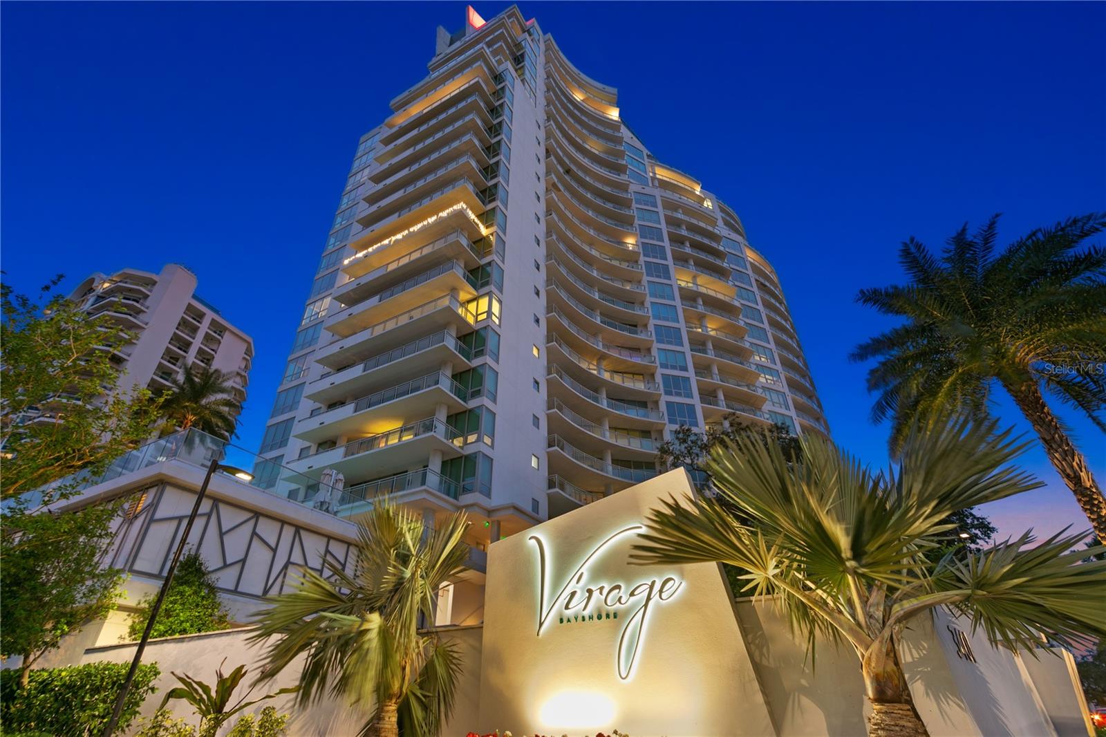 Looking for amazing views . . . . Welcome home to this sophisticated, yet
understated, residence at The Virage on Tampa’s iconic Bayshore Boulevard. From the
moment you arrive at The Virage, you step into a well-curated lobby with soaring
ceilings and floor to ceiling windows overlooking a fabled grand oak with views
extending to the waters of Hillsborough Bay. Seamlessly you take one of the high-
speed elevators to the private elevator lobby entrance for your home. Stepping off into
your private sanctuary, you are enveloped in scenic water views that extend seamlessly
from sunrises in the east to mesmerizing sunsets in the west. It. Never. Gets. Old! The
thoughtfully designed floorplan provides for open concept living with a spacious Chef’s
delight kitchen featuring Wolf &amp; Subzero appliances with natural gas cooktop, two
ovens, warming drawer, and separate wine refrigerator. Beautiful waterfall quartz
counters envelop the expanded Island and include bar seating and enhanced storage,
perfect for extra prep space and hosting gatherings buffet style. Moving beyond the
kitchen, you enjoy a lovely dining space and separate reading nook with floor to ceilings
glass that blend seamlessly into living/great room. The large wrap around terrace
accessed from the primary bedroom as well as the living/great room provide for ample
outdoor entertaining and alfresco dining overlooking the water and City. The peaceful
primary bedroom enjoys oversized sliders with incomparable views, as you dose off at
night and wake in the morning. A well-appointed bath includes a deep soaking tub; split
vanities with loads of storage and a generous walk-in shower and not just one but two
walk in closets. Separated from the main living areas and primary bedroom are a
den/office and the 2nd and 3 rd bedrooms with walk in closets and ensuite baths. The
den/office and second bedroom have access to the sunset terrace with amazing views
extending to Old Tampa Bay, and the third bedroom enjoys water views to south
Bayshore and beyond. Loads of attractive finishes include hardwood flooring throughout
main living areas and den; porcelain tile in bathrooms, remote controlled electronic
blinds (enhance in primary with blackouts), custom finished closets, 2 conveniently
located parking spaces (1 with 240v plug for hybrid), and a roomy climate-controlled
storage closet just off laundry room (a rarity in this building). The building enjoys loads
of amenities including oversized heated pool, spa, outdoor grills, a full club room for
hosting larger private gatherings, separate private dining, full fitness center, spa room,
pet grooming center, covered dog run, unmatched guest parking, 2 guest suites, full
time on site management, plus 24-hr concierge to assist residents and guests alike. So,
what are you waiting for . . .. hurry and secure your private viewing before it is too late!