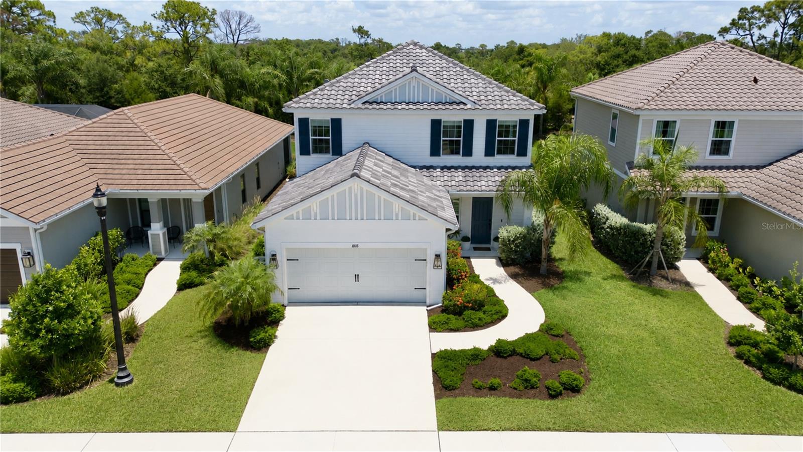 Talk about upgrades! This meticulously maintained home is completely move-in ready, with all the major upgrades already completed so you can simply unpack and enjoy the Florida lifestyle. From the moment you step inside, you'll be welcomed by an open-concept floor plan that immediately draws your eye to the stunning backyard oasis.

Designed for entertaining, the custom 16' x 27' saltwater pool is truly the centerpiece of the home. It features elegant sandblasted marble decking, two color-changing LED lights, a 140,000 BTU pool heater, and is enclosed by an impressive 37' x 33' x 45' aluminum pool cage with premium No-See-Um screening, allowing you to enjoy your outdoor space year-round in comfort.

Inside, you'll appreciate the thoughtful upgrades throughout, including luxury vinyl plank flooring, upgraded lighting fixtures, and custom window treatments that add both style and function. Upstairs, the rear-facing hurricane-impact windows provide added peace of mind while eliminating the need to install hurricane shutters over the pool lanai.

Located in the highly sought-after Grand Park community, the HOA provides exceptional value with full lawn maintenance, including mowing, edging, trimming, fertilization, weed control, annual mulching, and maintenance of all common areas, giving you more time to enjoy the community's outstanding amenities. Residents have access to a resort-style clubhouse, fitness center, pickleball and tennis courts, walking and nature trails, dog parks, playground, and a full-time lifestyle director who keeps the calendar filled with social events. The gated community also offers the privacy and security of private roads.

Perfectly situated just minutes from UTC's premier shopping and dining, championship golf courses, downtown Sarasota, and the world-famous Gulf Coast beaches, this exceptional home offers the perfect blend of luxury, convenience, and the Florida lifestyle you've been dreaming of.