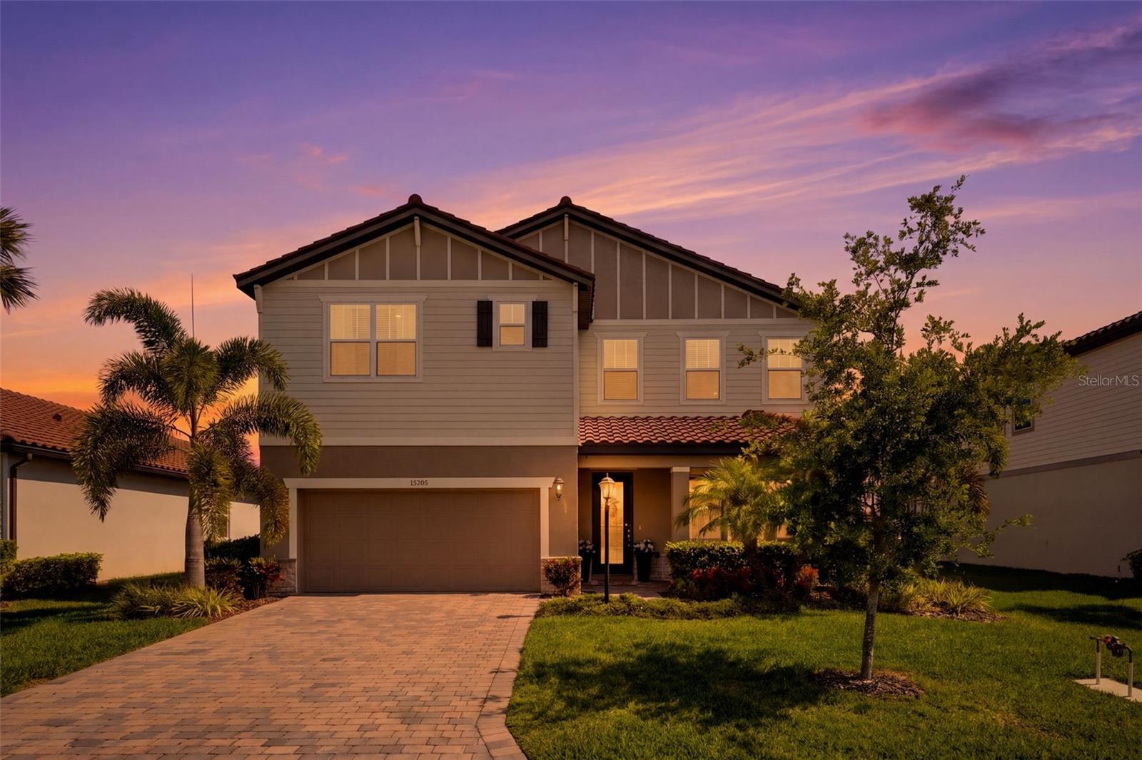 Experience the perfect blend of comfort, nature, and modern design in this beautifully maintained 4-bedroom plus private office home located in a sought-after resort-style pool community. A fresh opportunity to own a like-new condition home that's move in ready, it's the ideal canvas to create a space that reflects your own style and personality.

Built by Meritage Homes with energy efficiency and quality craftsmanship in mind, this home showcases an impressive list of upgrades including a gas cooktop with outside venting, oversized kitchen island, upgraded appliances, dual wall ovens, quartz countertops, under-cabinet lighting, porcelain tile flooring, and beautifully custom bath surrounds. Whether preparing meals for family or entertaining guests, the open-concept kitchen and living areas create an inviting space designed for everyday living.

Enjoy Florida at its finest with both indoor and outdoor dining overlooking a peaceful park-like backyard. Backing directly to a tranquil pond, the home offers picturesque water views and a front-row seat to Florida's natural beauty. Spend quiet mornings watching sandhill cranes stroll the shoreline, colorful green parrots pass overhead, largemouth bass break the water at sunset, or catch the occasional bald eagle and osprey fishing nearby. The desirable southern rear exposure keeps the covered lanai comfortably shaded through much of the day, making it the perfect setting to relax with a cup of coffee, enjoy dinner outdoors, read a favorite book, or entertain family and friends.

The spacious primary suite serves as a private retreat featuring serene pond views, dual vanities, a large walk-in shower, and an oversized walk-in closet. Upstairs, the expansive bonus room provides exceptional flexibility as a media room, game room, playroom, second family room, fitness area, or additional gathering space to fit your lifestyle.

Thoughtful features continue throughout the home with a whole-house dehumidification system for year-round comfort, energy-efficient insulation, durable tile roof construction, and fiber internet available for today's connected lifestyle. The attractive paver driveway, mature landscaping, and beautifully maintained common areas—cared for by the HOA—create outstanding curb appeal from the moment you arrive.

Residents enjoy an exceptional amenity package featuring a resort-style swimming pool, clubhouse, fitness center, basketball court, dedicated dog park, scenic walking trails, numerous ponds and preserved natural spaces that create an open, peaceful atmosphere throughout the neighborhood. Community events and social activities throughout the year foster a welcoming environment where neighbors quickly become friends.

Ideally located in the heart of Lakewood Ranch, you'll enjoy convenient access to shopping, dining, entertainment, medical facilities, and everyday conveniences. World-renowned Gulf Coast beaches—including Anna Maria Island, Siesta Key, Venice Beach, Manasota Key, and Clearwater Beach—are all within easy driving distance, offering endless opportunities to enjoy Florida's white sand beaches and spectacular sunsets.
Move-in ready and now offered at a new price, this exceptional home combines quality construction, beautiful waterfront views, outstanding community amenities, and an unbeatable location into a lifestyle that's as relaxing as it is rewarding. Schedule your private showing today and discover everything this remarkable home has to offer.