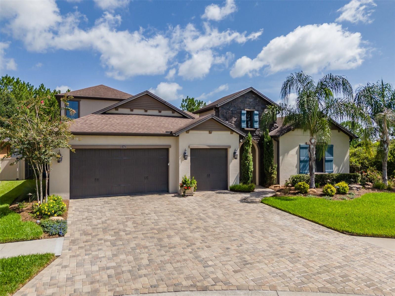 Welcome Home to 31961 Sandspirit Place in the coveted Windsor community in Meadow Pointe!
Tucked away on a private street in a quiet cul-de-sac, this stunning 5-bedroom, 4.5-bathroom home offers over 3,600 square feet of thoughtfully designed living space, including a versatile loft on the second floor — perfect for a media room, home office, gym or play space. It features a unique portico and courtyard entry, making each arrival a grand experience.
Inside, an open floor plan connects the gourmet kitchen, formal dining area, and living space, making this home perfect for entertaining. Huge sliding glass doors lead out to the private saltwater pool and spa, framed by beautiful conservation views. The primary suite is conveniently located on the first floor, along with a private guest suite — ideal for visitors or multigenerational living. Abundant storage can be found throughout this pristine home, situated on a large lot with neighbors on just one side for added privacy.
Step outside to your own private oasis: a saltwater pool with spa, featuring a brand-new heater element (2026), new pool pump (2026), new salt cell (2025), and a multicolor LED lighting system (2025) for stunning evening ambiance. The professionally landscaped yard and upgraded exterior lighting create true curb appeal, while a dedicated dog run makes this home as pet-friendly as it is beautiful.
Car and hobby enthusiasts will love the show-stopping 3-car garage, complete with Racedeck flooring, overhead lighting for detailing, overhead storage, and a Gladiator wall system for effortless organization.
Additional upgrades deliver peace of mind and lasting value: the entire home was freshly painted in 2022, the water heater was replaced in 2024, most ceiling fans have been updated, and driveway pavers added to match the courtyard. 
Located in the sought-after Windsor community, residents enjoy an abundance of amenities paired with low HOA fees — the best of both worlds. No flood insurance required.
This is a rare opportunity to own a meticulously maintained home with resort-style outdoor living and garage space built for enthusiasts — all on one of Wesley Chapel's most private streets. Convenient access to I275 & I75, hospitals, The Shops at Wiregrass Mall, Tampa Premium Outlets, dining, entertainment and more.