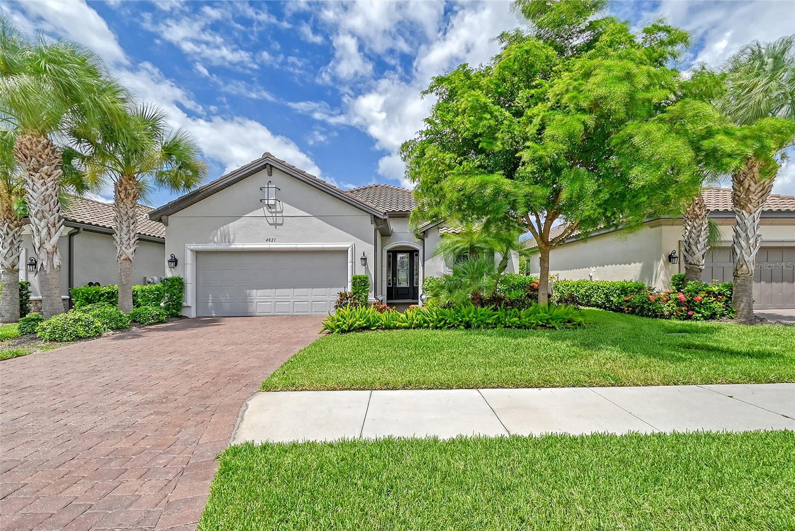 Architectural elegance abounds in this popular Lazio floor plan/ This home features 3 generous bedrooms, 3 full baths with den/office. Tile throughout the living area with Luxury Vinyl in the master bedroom & den. Gourmet kitchen with white cabinets & expresso center island, quartz counters & upgraded stainless steel appliances. $10,000 in custom window treatments & drapes. Large covered lanai area with outdoor kitchen, marble pavers, solar heated pool with private courtyard view. Pride of ownership throughout this 7 year young home. Home is equipped with hurricane shutters for low insurance. Move in ready. Cobblestone is a maintenance free community on Palmer Ranch with life style amenities such as; clubhouse, dog park, fitness center, community pool & spa, pickleball & bocci.