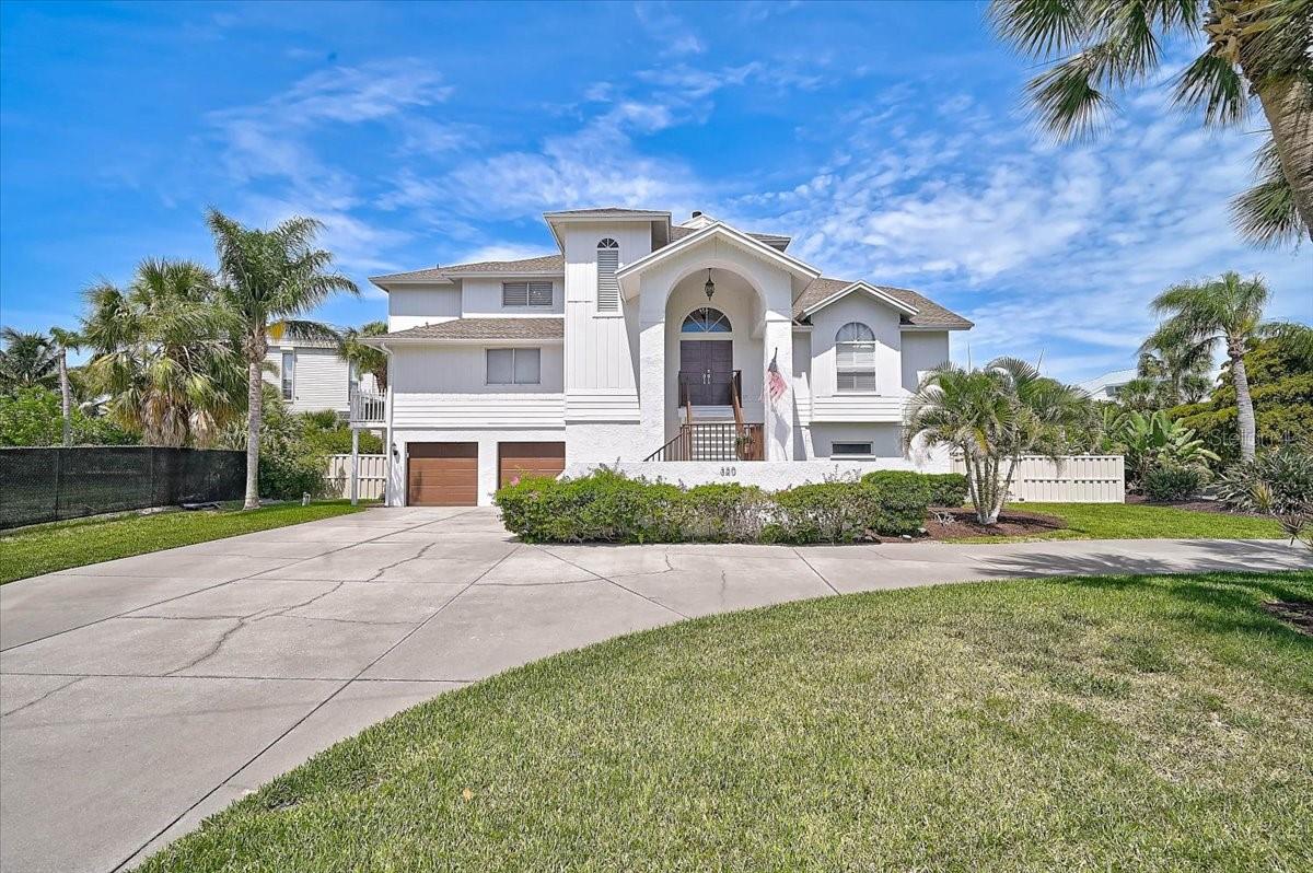 Nestled within the exclusive, 11-home Ringling Point enclave of Sarasota's coveted Sapphire Shores neighborhood, this exceptional waterfront residence offers the perfect blend of privacy, elegance, and coastal lifestyle. Featuring approximately 5,100 square feet of living space, this home boasts five bedrooms, four and half baths, soaring volume ceilings, and an open-concept floor plan designed for both comfortable living and effortless entertaining. 
This gem has been recently renovated providing a warm and inviting coastal vibe featuring an all-new gourmet kitchen, luxury bathrooms, and stunning hardwood flooring throughout. Expansive windows capture a plethora of natural light and breathtaking views of Sarasota Bay. The home sits high and dry above the flood plain and was never affected by any water intrusion from previous storms. 
Outdoor living takes center stage with a spacious deck overlooking a private resort-style pool surrounded by lush tropical landscaping. A fully fenced backyard creates a secluded retreat that leads out to your private boat dock complete with a lift in the protected Sapphire Shores Cove offering convenient access to Sarasota Bay for the boating enthusiasts. 
Additional highlights include abundant storage space, an oversized two-car garage, mature landscaping, and a premium location just minutes from downtown Sarasota, world-renowned Gulf beaches, cultural attractions, and Sarasota-Bradenton International Airport. 
A rare opportunity to enjoy waterfront living in one of Sarasota's most desirable neighborhoods.