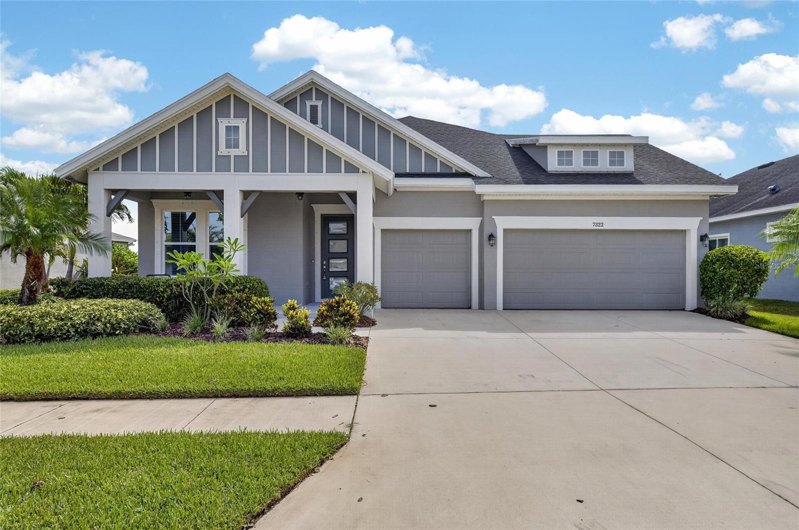 7322 Paradiso Drive, Apollo Beach, FL 33572 | 4 Bedrooms | 3 Bathrooms | 2,504 Sq Ft | Waterset

Welcome to 7322 Paradiso Drive, a beautifully upgraded lakefront home in the award-winning Waterset community of Apollo Beach. Built in 2020, this meticulously maintained one-story residence combines timeless Craftsman architecture with thoughtful design, modern finishes, and exceptional indoor-outdoor living. From the moment you enter, soaring ceilings, crown molding, tray ceilings, and an open-concept floor plan create a bright and inviting atmosphere. Ceramic tile flows throughout the main living areas, while the bedrooms offer the warmth and comfort of carpeting.

The gourmet kitchen is designed to be the centerpiece of the home, featuring solid wood cabinetry, stone countertops, a large center island, walk-in pantry, and abundant workspace for cooking, gathering, and entertaining. The spacious living and dining areas overlook the tranquil lake through expansive sliding glass doors, creating a seamless connection between indoor and outdoor living. A private home office with glass French doors provides the perfect space for remote work, studying, or a quiet retreat.

The primary suite offers peaceful lake views and a spacious walk-in closet, while the luxurious ensuite bath features dual stone-top vanities, a walk-in shower, and floor-to-ceiling tile finishes. Three additional bedrooms and two full guest bathrooms provide flexibility for family, guests, or multigenerational living.

Step outside to an impressive covered lanai overlooking the water and experience your own private backyard retreat. The heated pool and spa, outdoor kitchen, and fire pit create the perfect setting for entertaining or relaxing while enjoying beautiful Florida sunsets over the lake. Additional upgrades include a three-car garage, water softener system, solar energy storage system, and a 2020 roof, offering both convenience and energy efficiency.

Living in Waterset means enjoying one of Apollo Beach's premier master-planned communities with resort-style amenities including multiple heated pools, a clubhouse, state-of-the-art fitness center, tennis and pickleball courts, playgrounds, parks, and miles of scenic walking and biking trails. The community is golf-cart friendly and conveniently located near shopping, dining, waterfront recreation, top-rated schools, and I-75 for an easy commute to Tampa, St. Petersburg, Sarasota, and MacDill Air Force Base.

Offering luxury finishes, breathtaking lake views, exceptional outdoor living, and one of the most desirable lifestyles in Apollo Beach, 7322 Paradiso Drive is ready to welcome you home.

What the Seller Loves: "One of our favorite parts of living here is spending evenings by the pool watching the sun set across the lake. Whether we're grilling in the outdoor kitchen, relaxing in the spa, or gathering around the fire pit with friends and family, this backyard truly feels like a private resort. Inside, we love the open layout, the natural light, and having a dedicated office that makes working from home easy. Waterset has been an incredible community with beautiful walking trails, resort-style pools, fitness center, parks, and friendly neighbors. Being able to golf cart around the neighborhood while still being just minutes from shopping, restaurants, and everything Apollo Beach has to offer has made this an amazing place to call home."