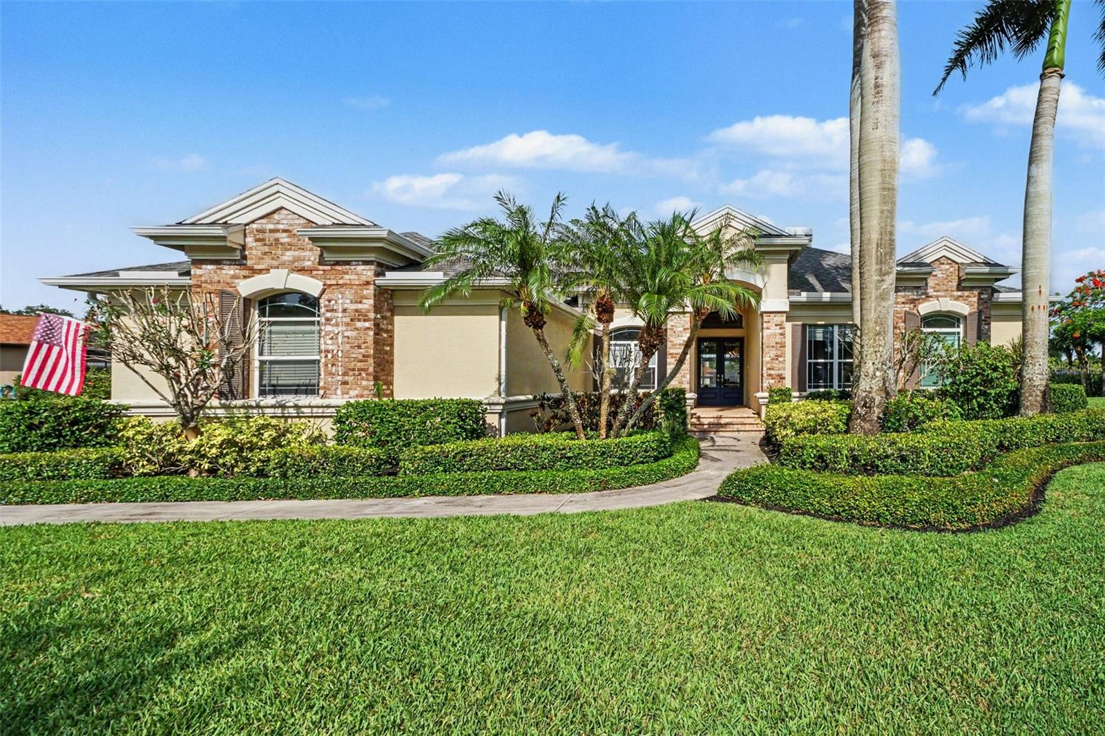 Experience lakefront living in Blackhawk, one of South Fort Myers' most exclusive gated communities featuring just 78 custom estate homes. Residents enjoy oversized homesites, mature landscaping, and a serene setting. Situated on a picturesque .67-acre homesite with tranquil water views, this beautifully updated custom residence offers over 3,700 square feet of thoughtfully designed living space, featuring 4 bedrooms, 3.5 baths, office, and a versatile media room.
At the heart of the home is the renovated kitchen 2015, showcasing timeless finishes and seamless flow into the main living areas. A fireplace creates a warm focal point, while expansive windows and sliding glass doors frame the lake views and fill the home with natural light.
Enjoy your own Florida retreat, where a panoramic picture-screen lanai overlooks the resort-style pool, spa, and peaceful waterfront setting. Enhanced in 2020, the expansive travertine pool deck, panoramic screen enclosure, outdoor kitchen 2015, and outdoor shower create an exceptional space for relaxation, entertaining, and embracing the Southwest Florida lifestyle.
Ideally located just minutes from premier shopping, dining, championship golf, Southwest Florida beaches, RSW International Airport, and spring training venues, this exceptional property offers both privacy and convenience in one of Fort Myers' most sought-after communities.